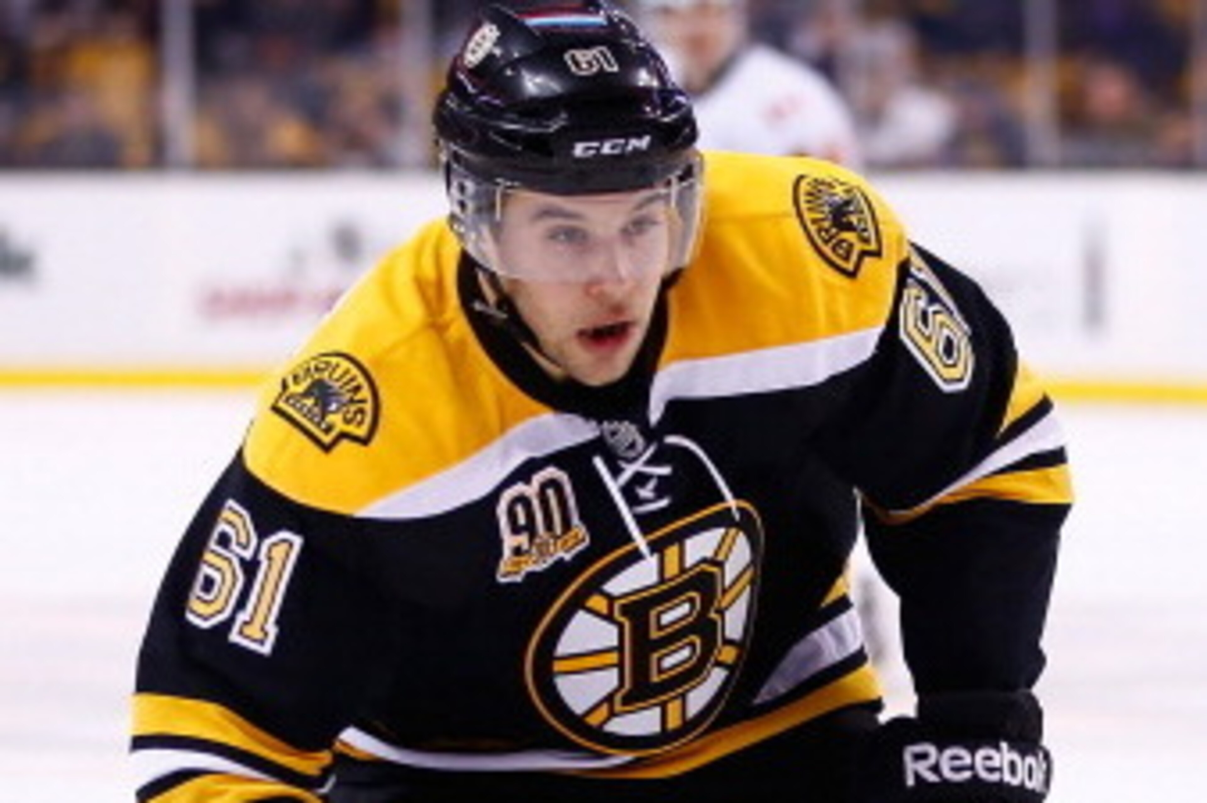 BOSTON, MA - DECEMBER 17:  Craig Cunningham #61 of the Boston Bruins skates against the Calgary Flames during the game at TD Garden on December 17, 2013 in Boston, Massachusetts.  (Photo by Jared Wickerham/Getty Images)