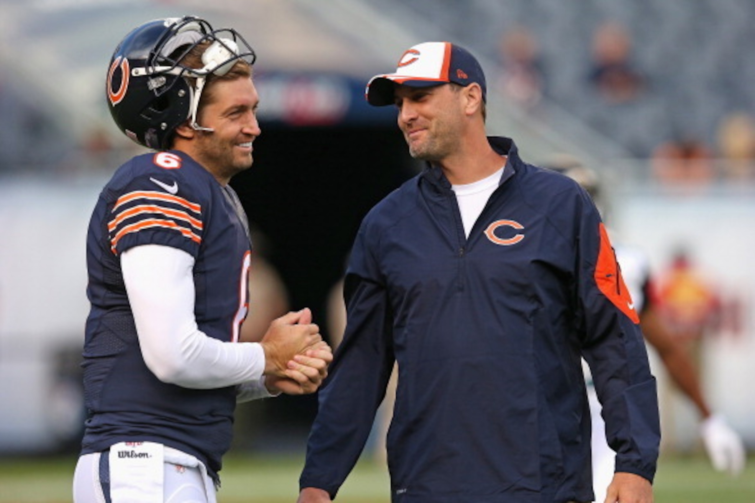 CHICAGO, IL - AUGUST 14: Jay Cutler #6 of the Chicago Bears talks with wide receivers coach Mike Groh during warmups prior to a preseason game against the Jacksonville Jaguars at Soldier Field on August 14, 2014 in Chicago, Illinois.  (Photo by Jonathan D