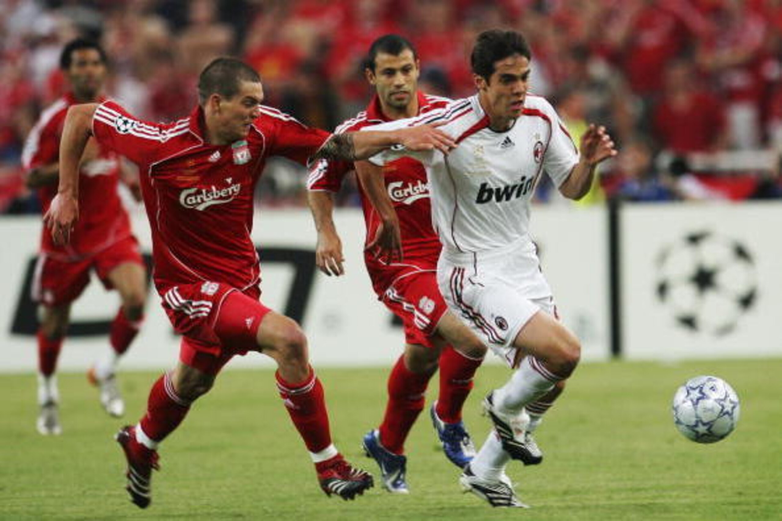 ATHENS, GREECE - MAY 23:  Kaka (R) of Milan breaks away from Daniel Agger (L) and Javier Mascherano of Liverpool during the UEFA Champions League Final match between Liverpool and AC Milan at the Olympic Stadium on May 23, 2007 in Athens, Greece.  (Photo 