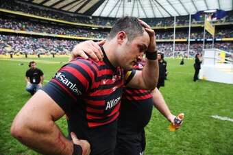LONDON, ENGLAND - MAY 31:  A dejected Brad Barritt of Saracens is consoled during the Aviva Premiership Final between Saracens and Northampton Saints at Twickenham Stadium on May 31, 2014 in London, England.  (Photo by David Rogers/Getty Images)