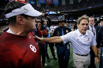 NEW ORLEANS, LA - JANUARY 02:  Head coach Bob Stoops of the Oklahoma Sooners is congratulated by Nick Saban, head coach of the Alabama Crimson Tide during the Allstate Sugar Bowl at the Mercedes-Benz Superdome on January 2, 2014 in New Orleans, Louisiana.