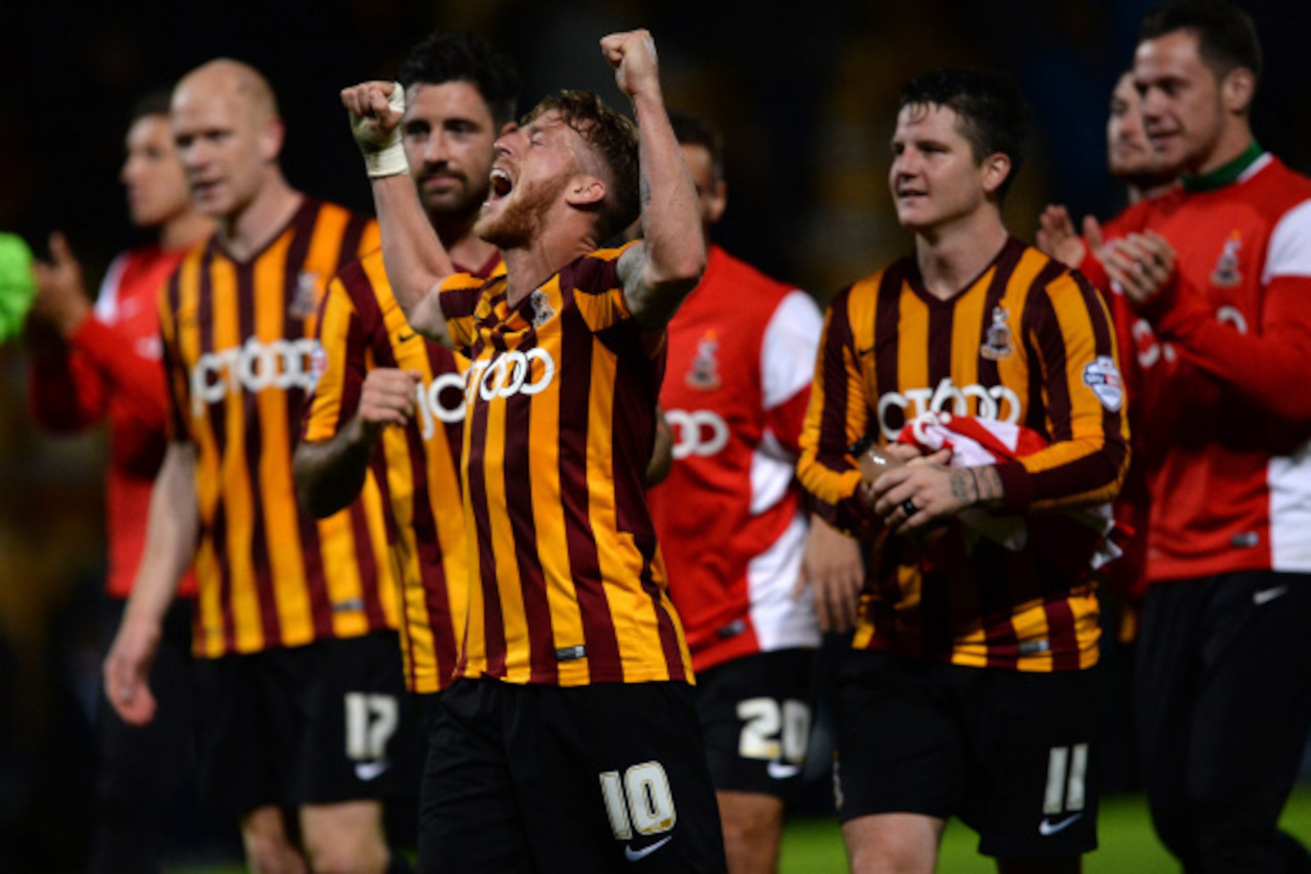 BRADFORD, ENGLAND - AUGUST 27:  Players of Bradford City react after their Capital One Cup second round match between Bradford City and Leeds United at Coral Windows Stadium, Valley Parade on August 27, 2014 in Bradford, England.  (Photo by Nigel Roddis/G