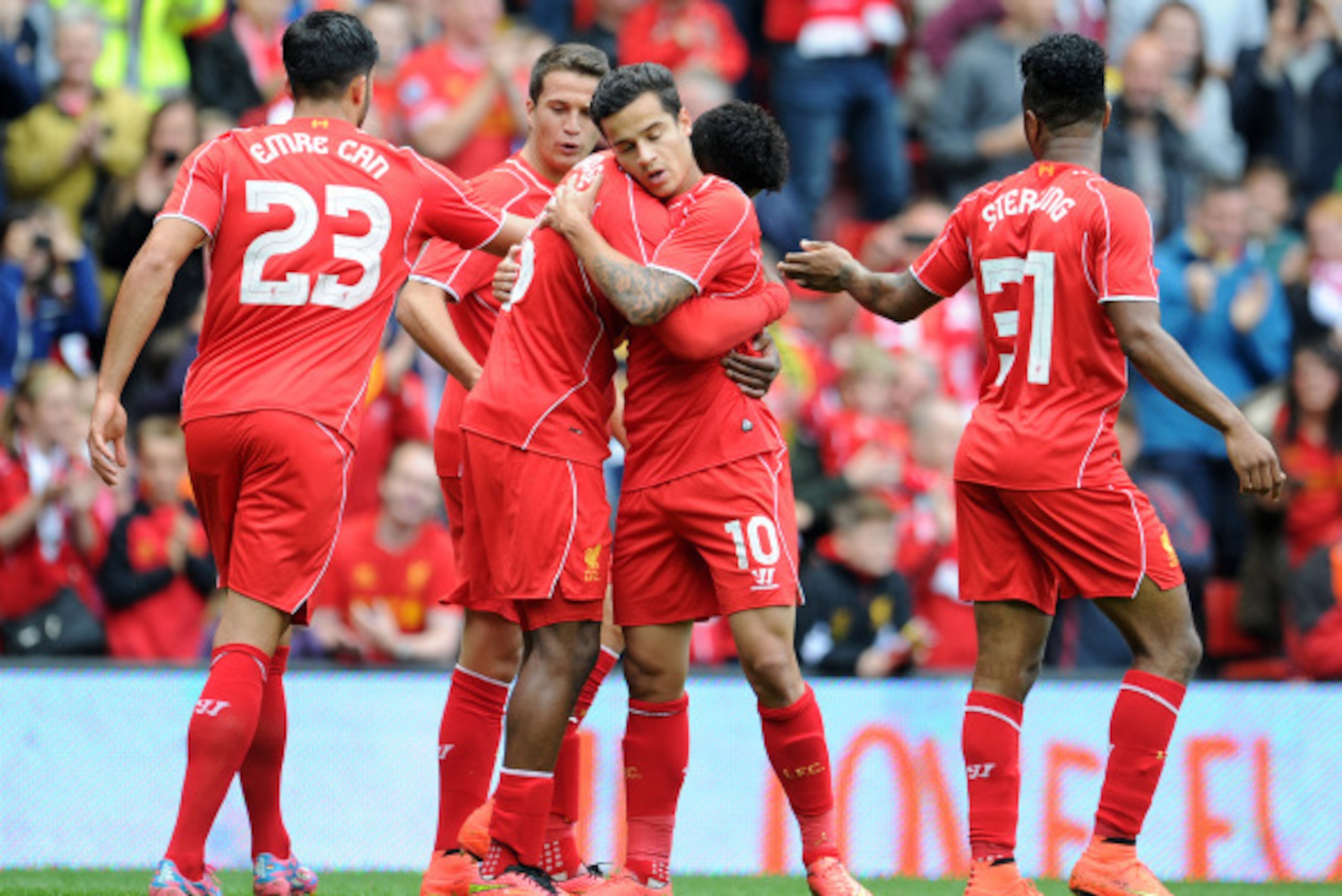 LIVERPOOL, ENGLAND - AUGUST 10:  Daniel Sturridge (C) of Liverpool celebrates with team-mate Philippe Coutinho after he scores the first goal of the game for his side during the Pre Season Friendly match between Liverpool and Borussia Dortmund at Anfield 