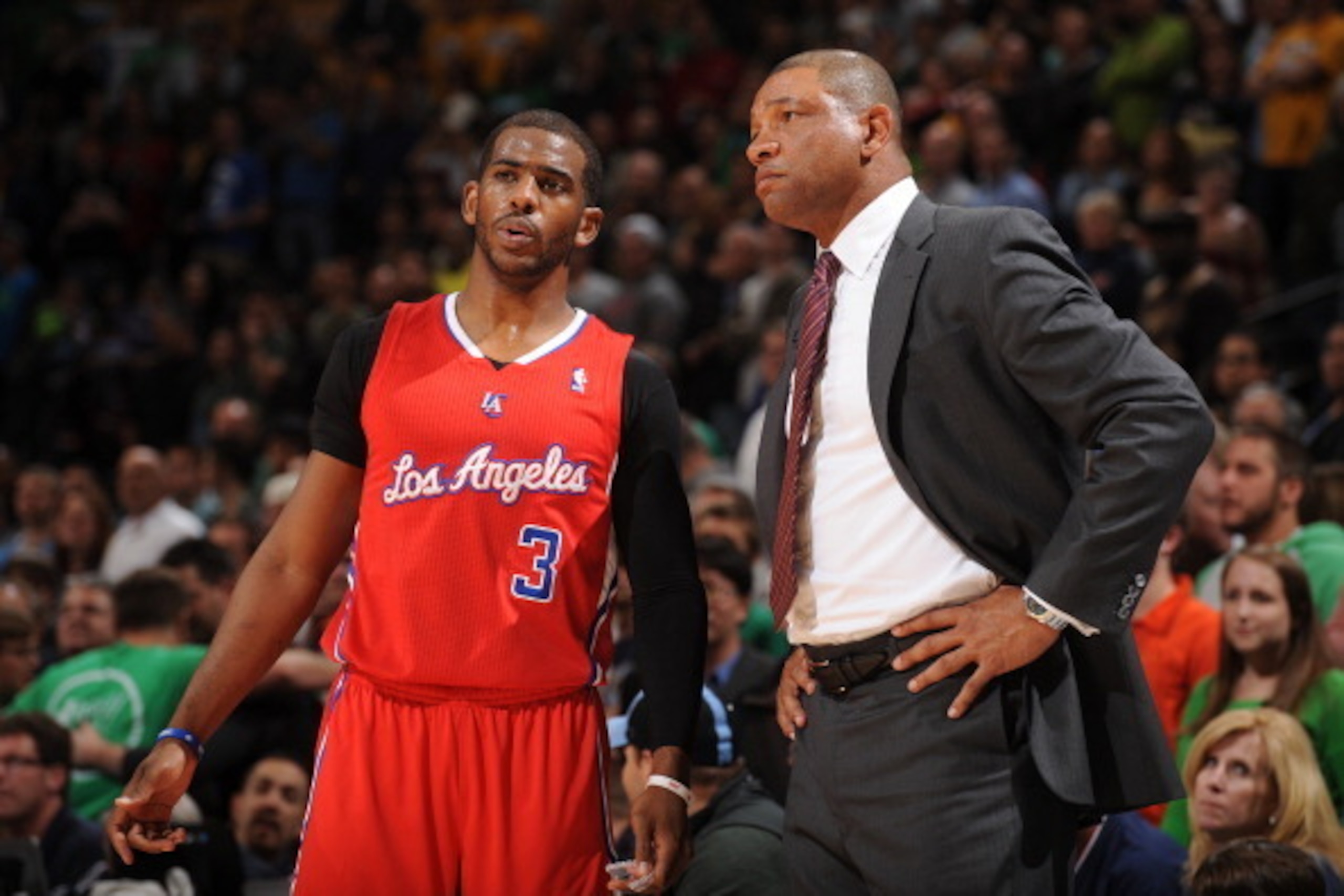 DENVER, CO - MARCH 17: Chris Paul #3 and Head Coach Doc Rivers of the Los Angeles Clippers have a discussion against the Denver Nuggets on March 17, 2014 at the Pepsi Center in Denver, Colorado. NOTE TO USER: User expressly acknowledges and agrees that, b