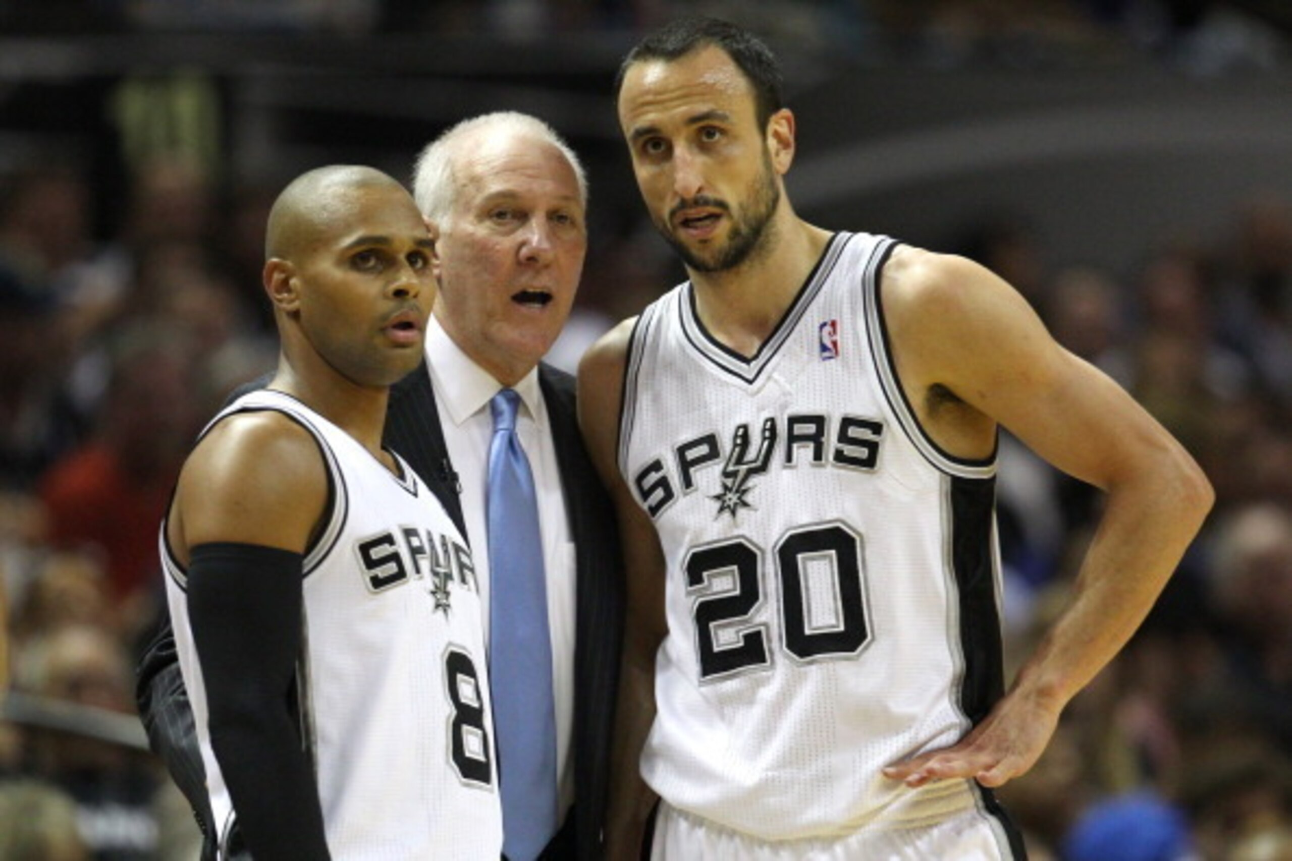 SAN ANTONIO, TX - MAY 21:  Head coach Gregg Popovich of the San Antonio Spurs talks with Patty Mills #8 and Manu Ginobili #20 in the first half while taking on the Oklahoma City Thunder in Game Two of the Western Conference Finals during the 2014 NBA Play