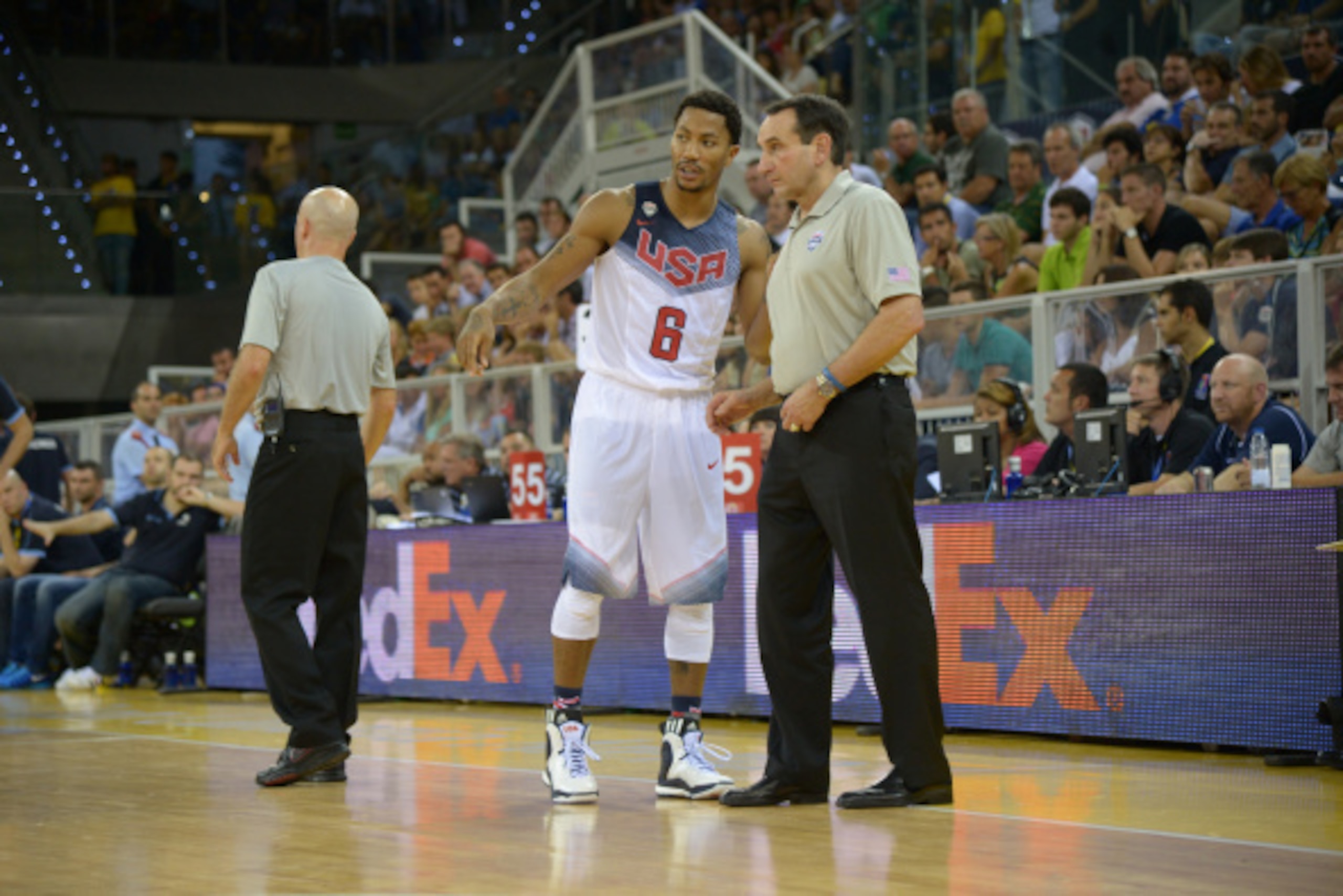 LAS PALMAS, GRAN CANARIA, SPAIN - AUGUST 26: Derrick Rose #6 talks to Head Coach Mike Krzyzewski of the USA Men's National Team in the game against the Slovenia National Team at Gran Canaria Arena in Las Palmas, Gran Canaria, Spain on August 26, 2014.  NO