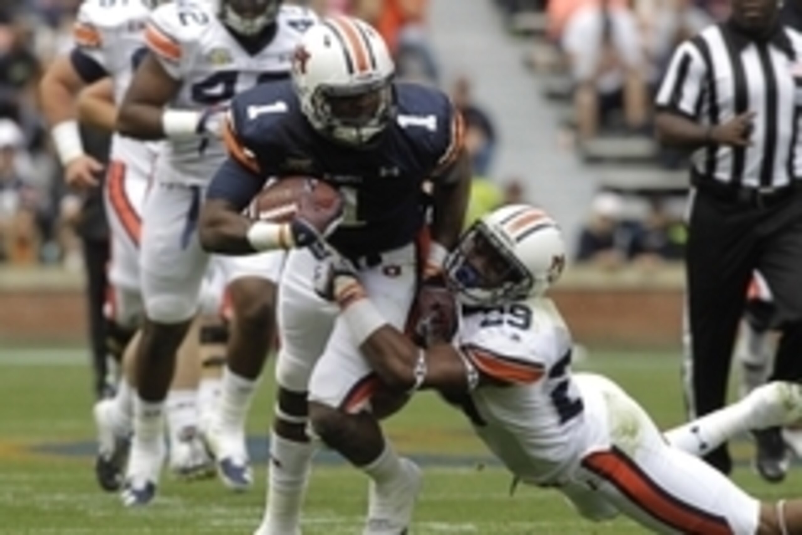 Apr 19, 2014; Auburn, AL, USA; Auburn Tigers receiver D'haquille Williams (1) is tackled by defensive back Brandon King (29) during the first half of the A-Day spring game at Jordan Hare Stadium. Mandatory Credit: John Reed-USA TODAY Sports