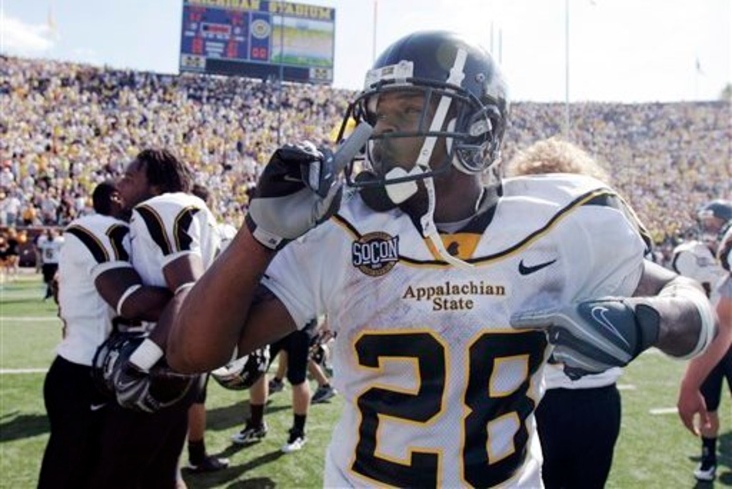 Appalachian State running back Kevin Richardson quiets a crowd left in stunned silence after the Mountaineers' 34-32 win at Michigan.
