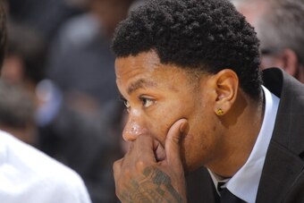 OAKLAND, CA - FEBRUARY 6: Derrick Rose #1 of the Chicago Bulls inactive for the game against the Golden State Warriors on February 6, 2014 at Oracle Arena in Oakland, California. NOTE TO USER: User expressly acknowledges and agrees that, by downloading an