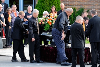 TURIN, NY - AUGUST 14:  Pallbearers help to carry the casket of sprint car driver Kevin Ward Jr. at South Lewis Senior High School on August 14, 2014 in Turin, New York. Ward was killed August 9, when he exited his car during a dirt track race and was str