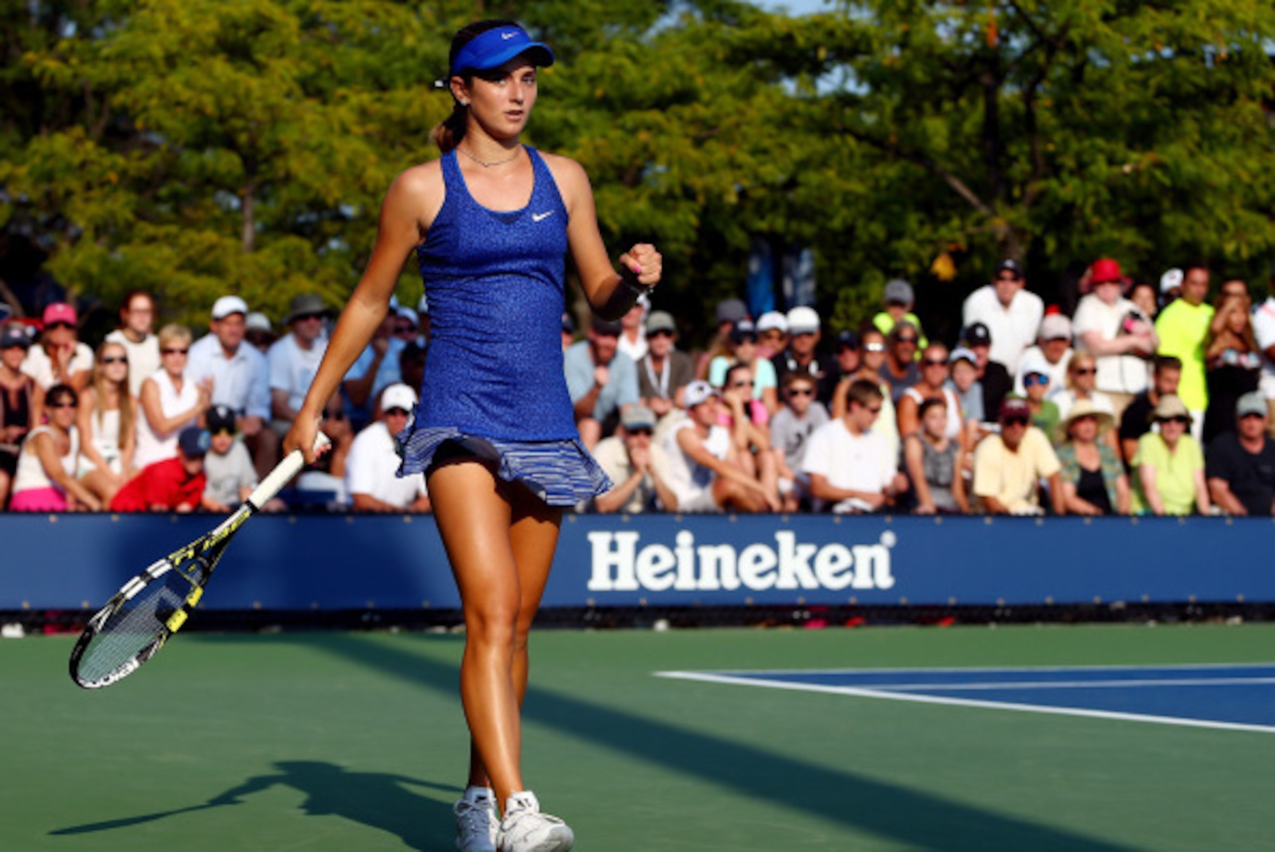 NEW YORK, NY - AUGUST 26:  Catherine Bellis of the United States celebrates against Dominika Cibulkova of Slovakia during their women's singles first round match on Day Two of the 2014 US Open at the USTA Billie Jean King National Tennis Center on August 