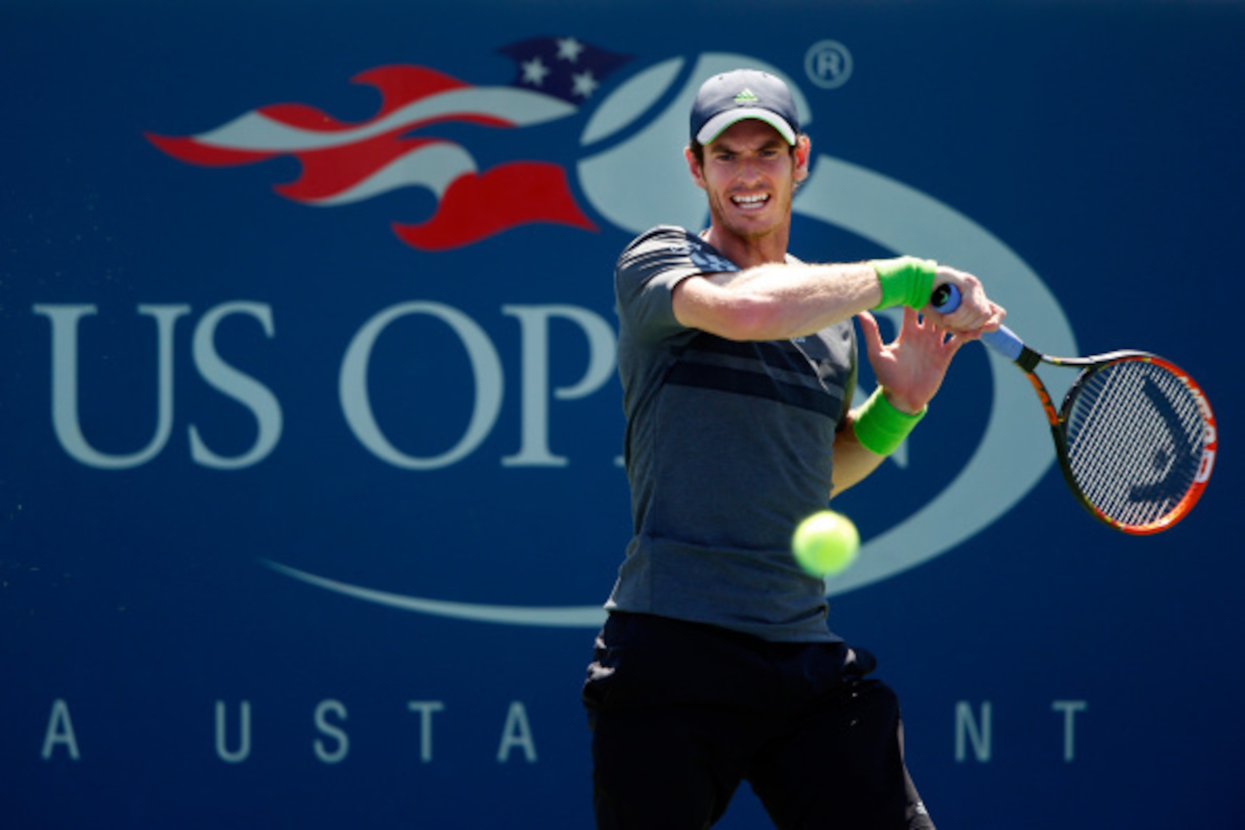 NEW YORK, NY - AUGUST 25:  Andy Murray returns a shot against Robin Haase of the Netherlands on Day One of the 2014 US Open at the USTA Billie Jean King National Tennis Center on August 25, 2014  in the Flushing neighborhood of the Queens borough of New Y