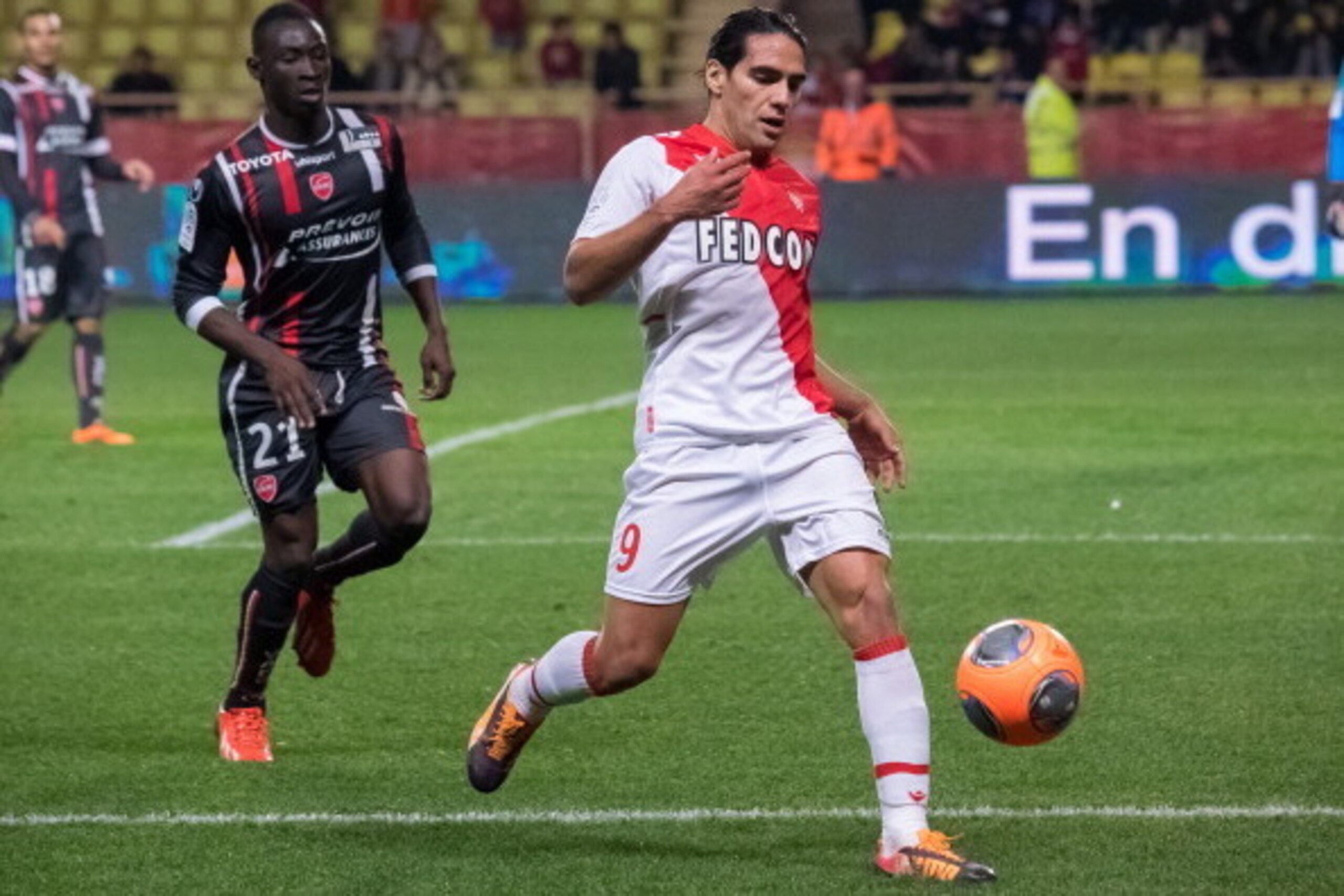 MONTE-CARLO, MONACO - DECEMBER 20:  Monaco's foward Radamel Falcao (R) challenges Valenciennes's defender Saliou Ciss (L)  during the French L1 football match between AS Monaco vs Valenciennes at Louis II Stadium on December 20, 2013 in Monte-Carlo, Monac