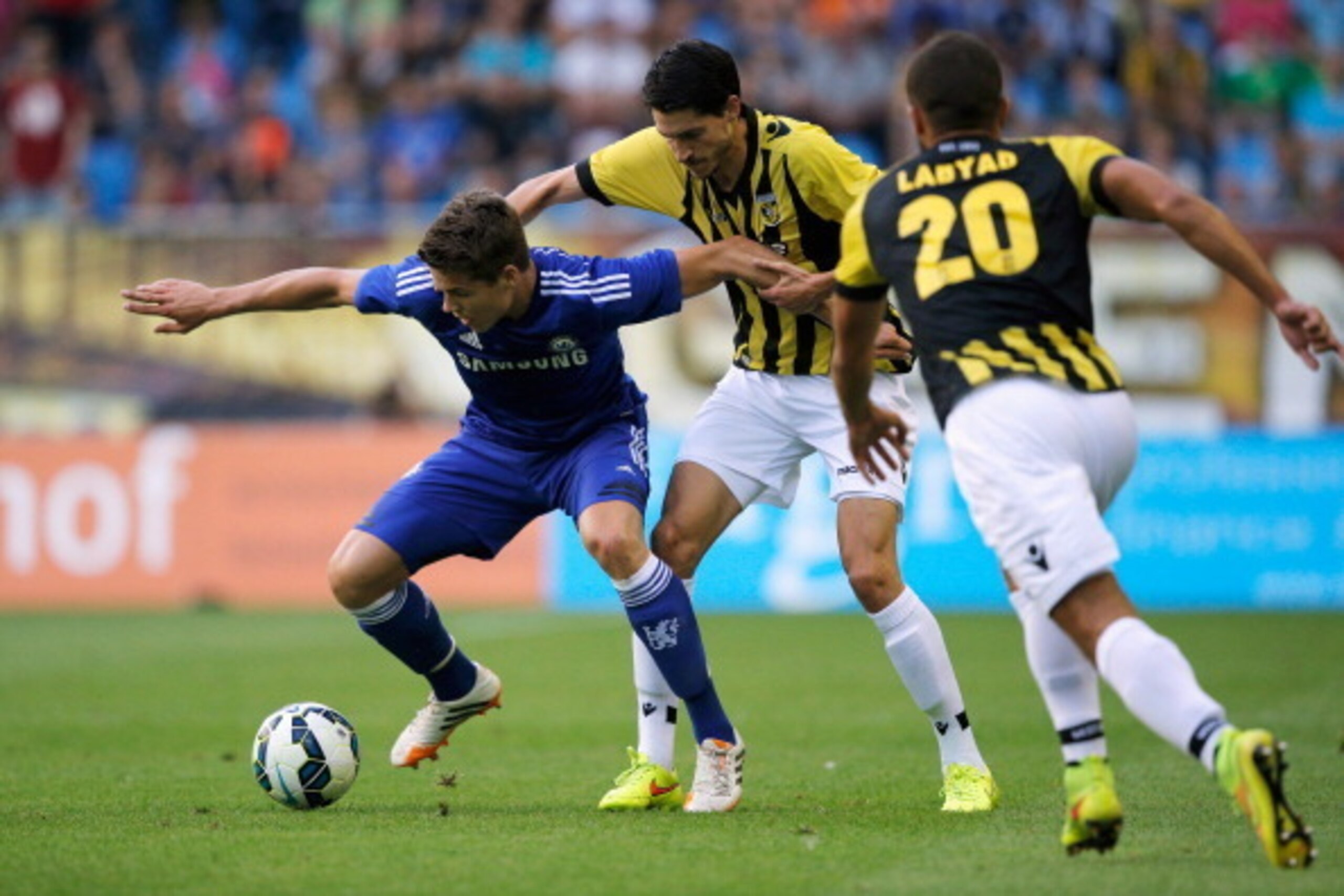 ARNHEM, NETHERLANDS - JULY 30:  Marko Vejinovic of Vitesse and Marco van Ginkel of Chelsea battle for the ball during the pre season friendly match between Vitesse Arnhem and Chelsea at the Gelredome Stadium on July 30, 2014 in Arnhem, Netherlands.  (Phot