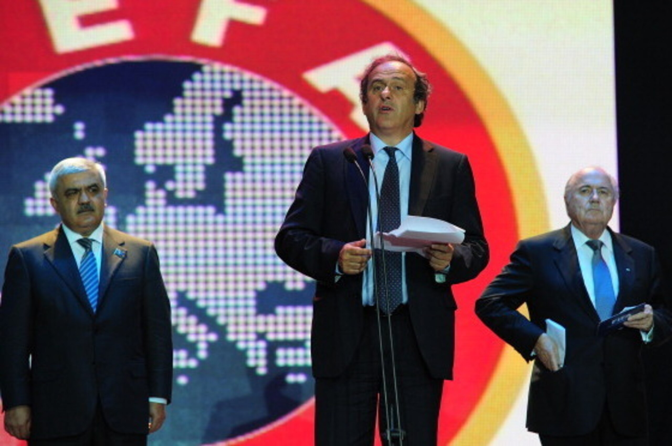BAKU, AZERBAIJAN - JUNE 06:  UEFA president Michel Platini speaks as FIFA president Sepp Blatter (R) looks on during a dinner celebration to mark 100 years of Football in Azerbaijan on June 6, 2011 in Baku, Azerbaijan.  (Photo by Stu Forster/Getty Images)