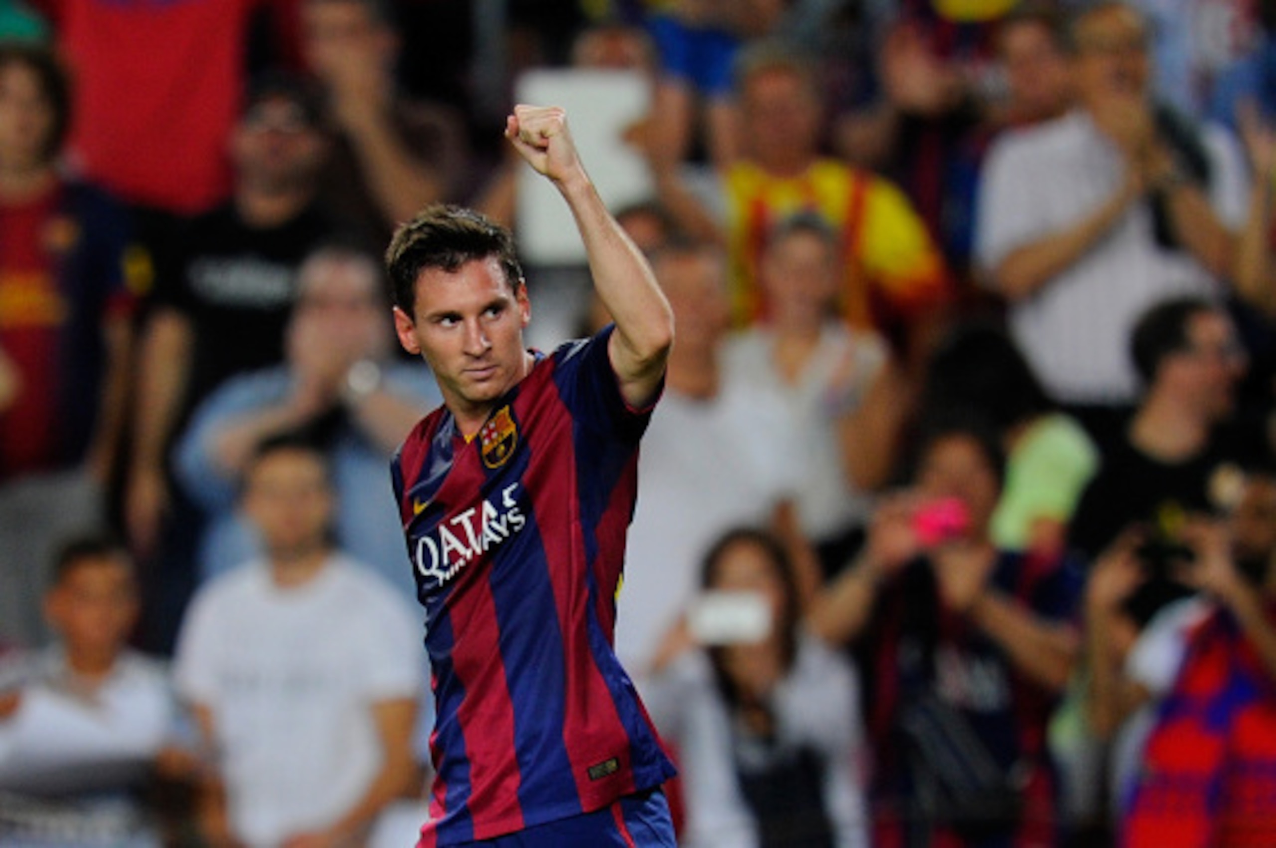 BARCELONA, SPAIN - AUGUST 24:  Lionel Messi of FC Barcelona celebrates scoring  his team's opening goal during the La Liga match between FC Barcelona and Elche FC at Camp Nou stadium on August 24, 2014 in Barcelona, Spain.  (Photo by Denis Doyle/Getty Ima