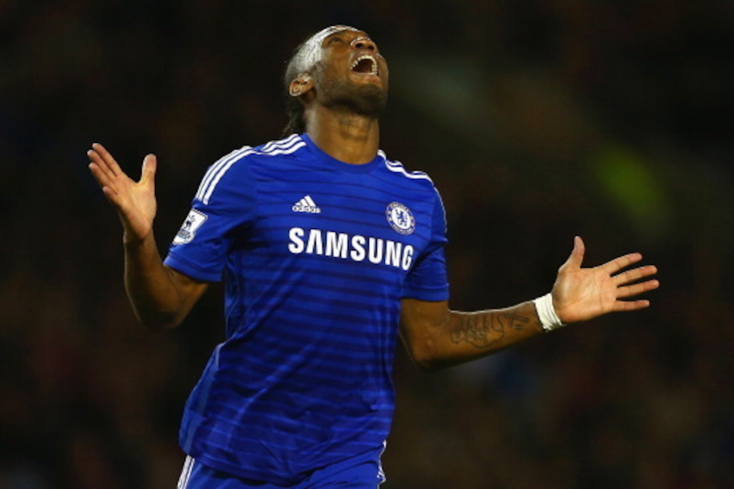 BURNLEY, ENGLAND - AUGUST 18:  Didier Drogba of Chelsea reacts after a missed chance during the Barclays Premier League match between Burnley and Chelsea at Turf Moor on August 18, 2014 in Burnley, England.  (Photo by Clive Brunskill/Getty Images)