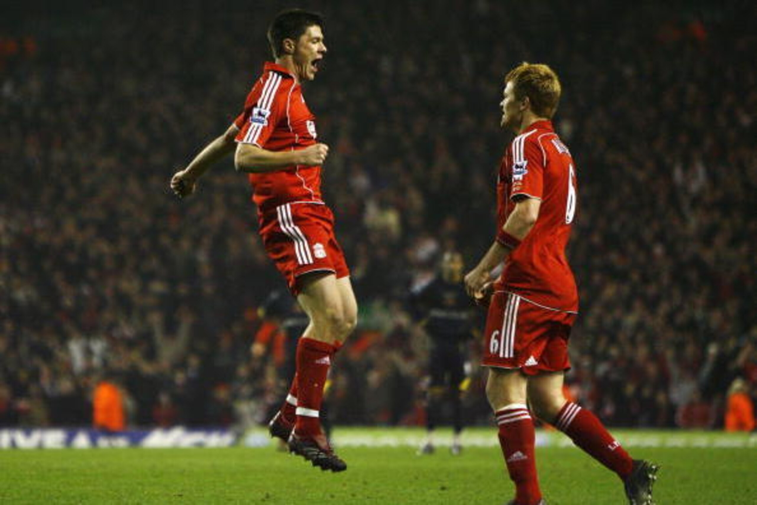 LIVERPOOL, UNITED KINGDOM - DECEMBER 23:  Xabi Alonso (L) of Liverpool is congratulated by team mate John Arne Riise after scoring his team's second goal during the Barclays Premiership match between Liverpool and Watford at Anfield on December 23, 2006 i