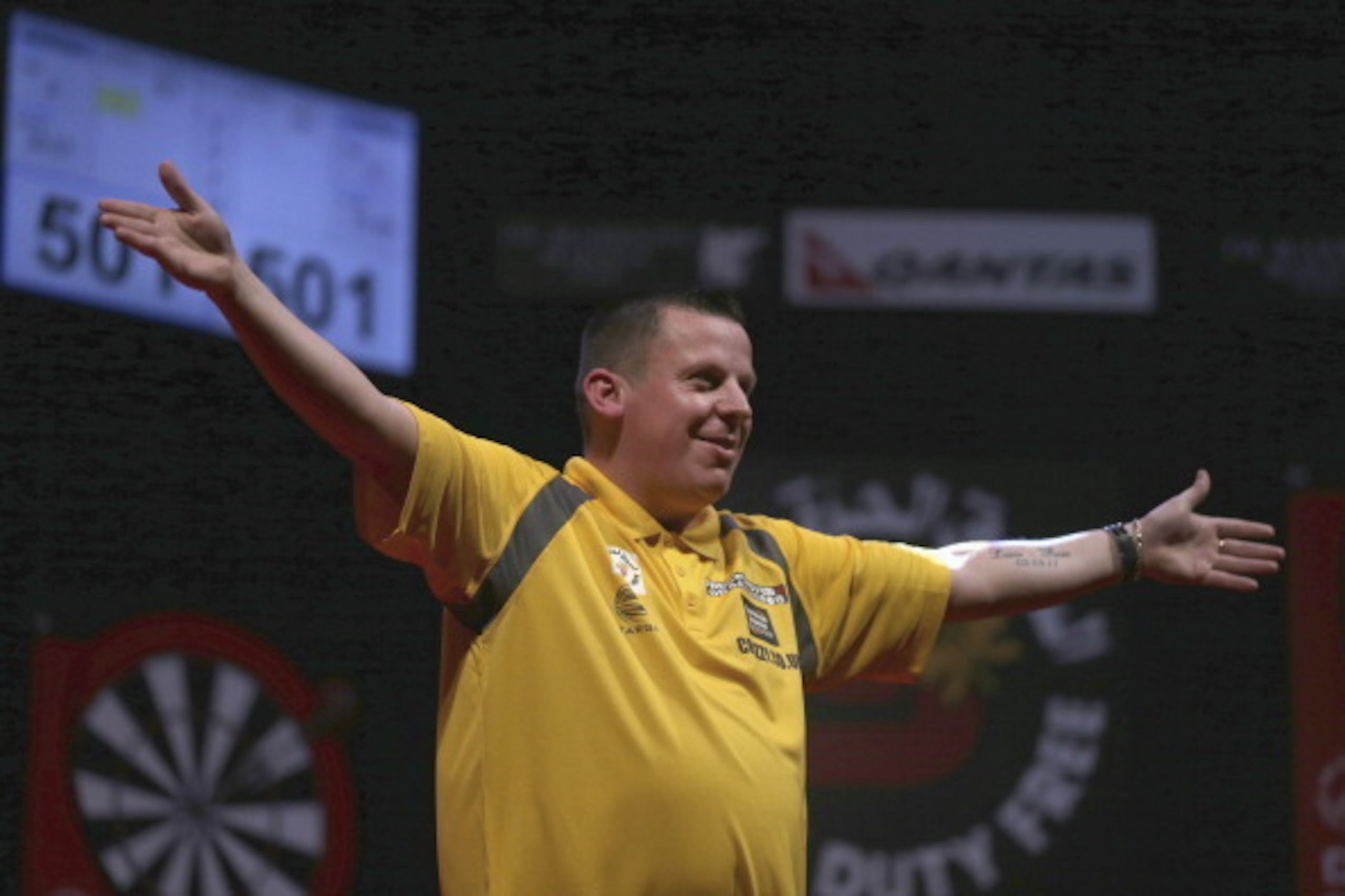 DUBAI, UNITED ARAB EMIRATES - MAY 29:  Dave Chisnall of England celebrates after defeating Simon Whitlock of Australia during the 2014 Dubai Duty Free Darts Masters Quarter-Final match at Dubai Duty Free Tennis Stadium, Irish Village on May 29, 2014 in Du