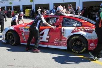 Kevin Harvick's car gets a team push to inspection at Daytona.