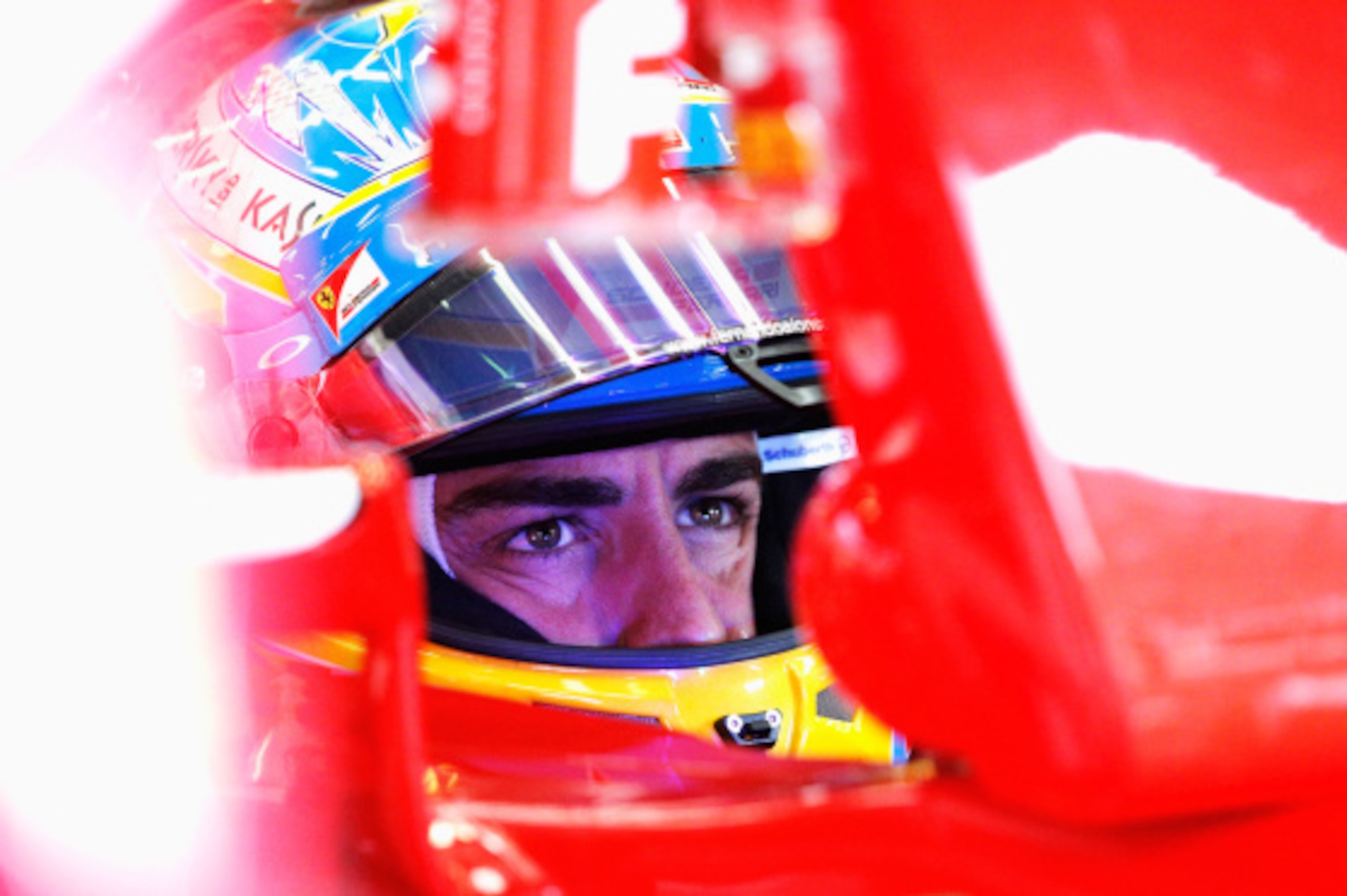 SPA, BELGIUM - AUGUST 22:  Fernando Alonso of Spain and Ferrari sits in his car in the garage during practice ahead of the Belgian Grand Prix at Circuit de Spa-Francorchamps on August 22, 2014 in Spa, Belgium.  (Photo by Dean Mouhtaropoulos/Getty Images)