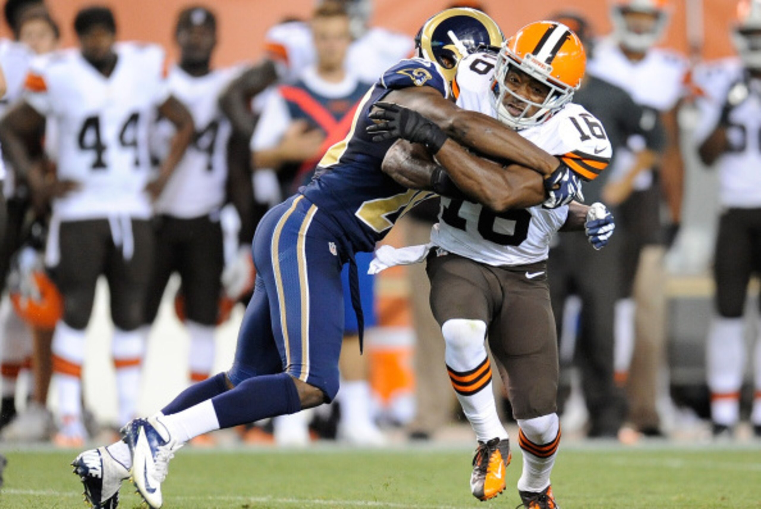 CLEVELAND, OH - AUGUST 23:  Andrew Hawkins #16 of the Cleveland Browns breaks a tackle by Lamarcus Joyner #20 of the St. Louis Rams during the second quarter at FirstEnergy Stadium on August 23, 2014 in Cleveland, Ohio.  (Photo by Joe Sargent/Getty Images