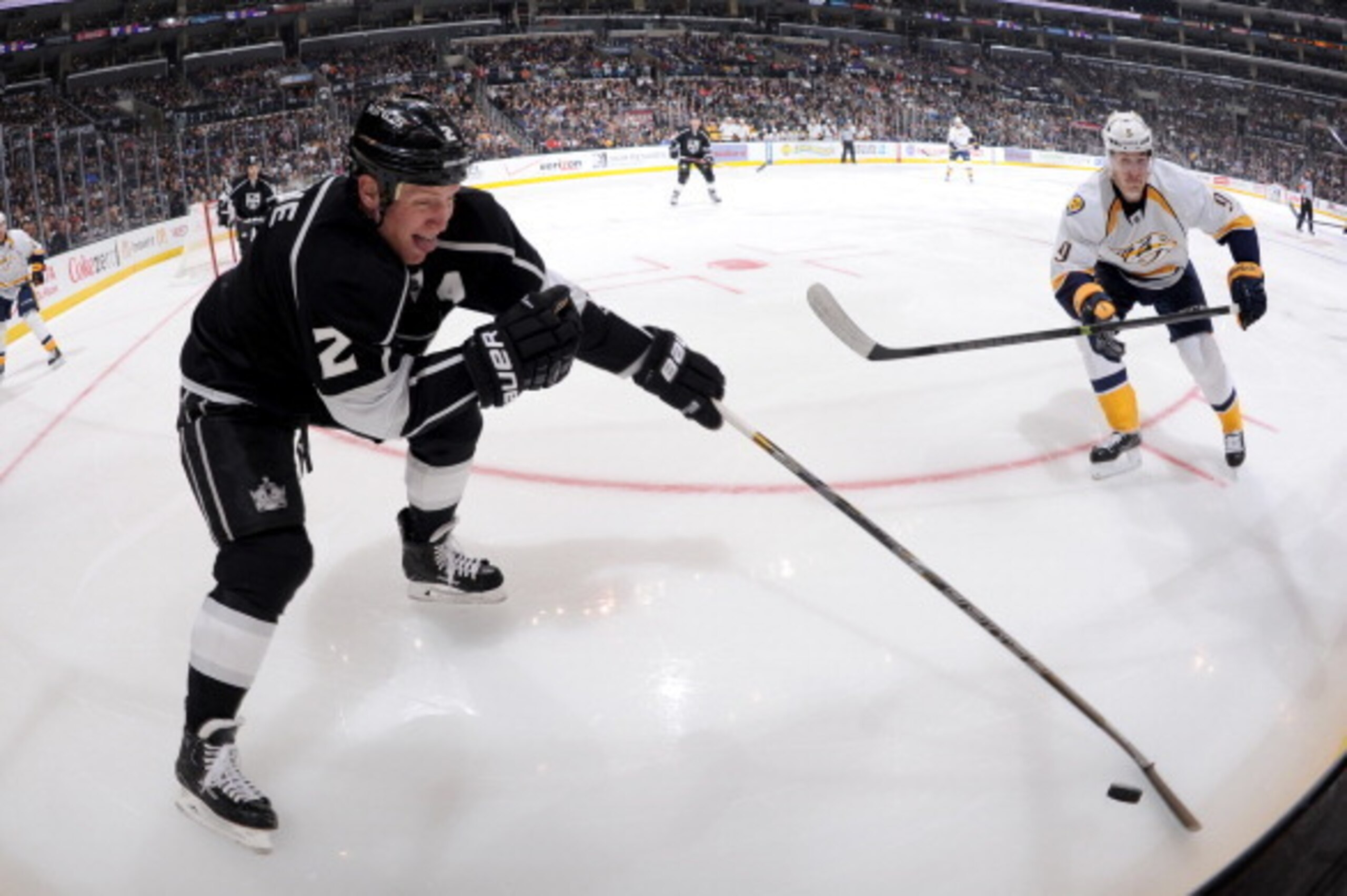 LOS ANGELES, CA - NOVEMBER 2: Matt Greene #2 of the Los Angeles Kings handles the puck against Filip Forsberg #9 of the Nashville Predators at STAPLES Center on November 2, 2013 in Los Angeles, California. (Photo by Andrew D. Bernstein/NHLI via Getty Imag