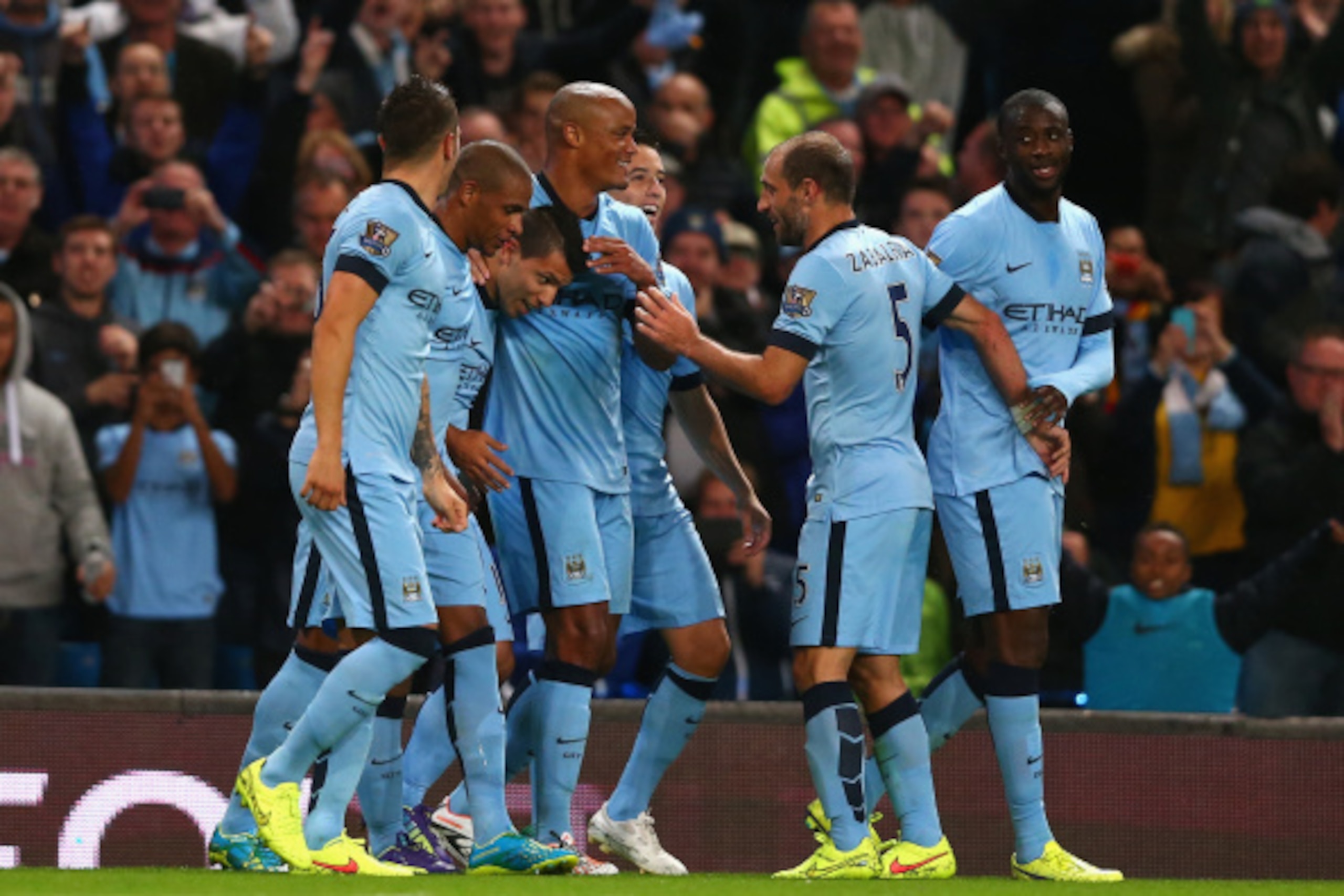 MANCHESTER, ENGLAND - AUGUST 25:  Sergio Aguero of Manchester City celebrates scoring the third goal with his team-mates during the Barclays Premier League match between Manchester City and Liverpool at the Etihad Stadium on August 25, 2014 in Manchester,