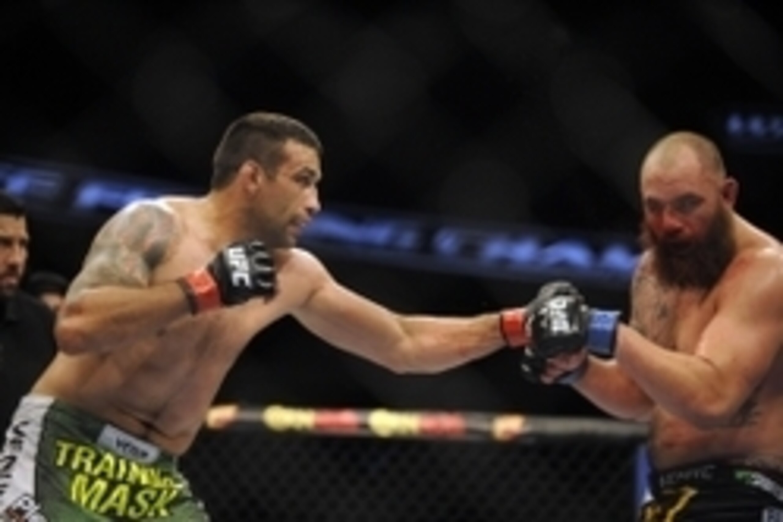 Apr 19, 2014; Orlando, FL, USA; Fabricio Werdum (red gloves) fights Travis Browne (blue gloves) before their heavyweight fight during UFC on FOX 11 at Amway Center. Mandatory Credit: David Manning-USA TODAY Sports