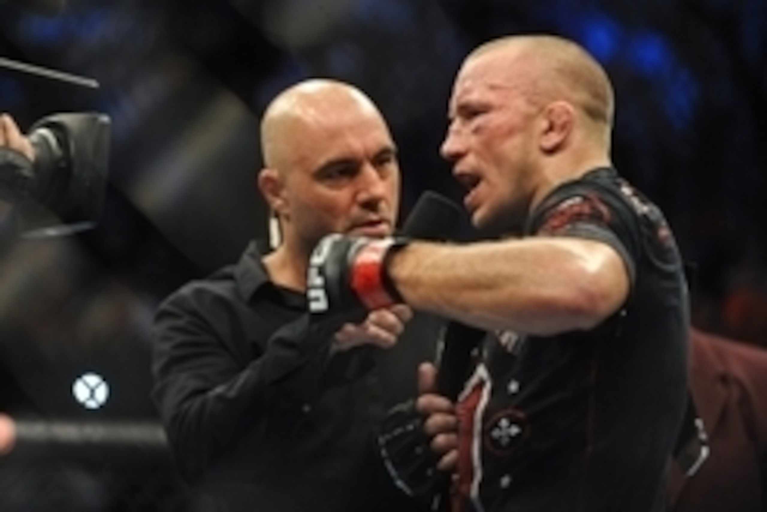 Nov 16, 2013; Las Vegas, NV, USA; Georges St-Pierre is interviewed by Joe Rogan after his welterweight championship bout against Johny Hendricks during UFC 167 at MGM Grand Garden Arena. Mandatory Credit: Stephen R. Sylvanie-USA TODAY Sports