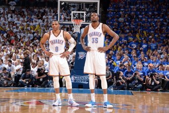 OKLAHOMA CITY, OK - MAY 27: Russell Westbrook #0 and Kevin Durant #35 of the Oklahoma City Thunder look on in Game Four of the Western Conference Finals against the San Antonio Spurs during the 2014 NBA Playoffs on May 27, 2014 at the Chesapeake Energy Ar