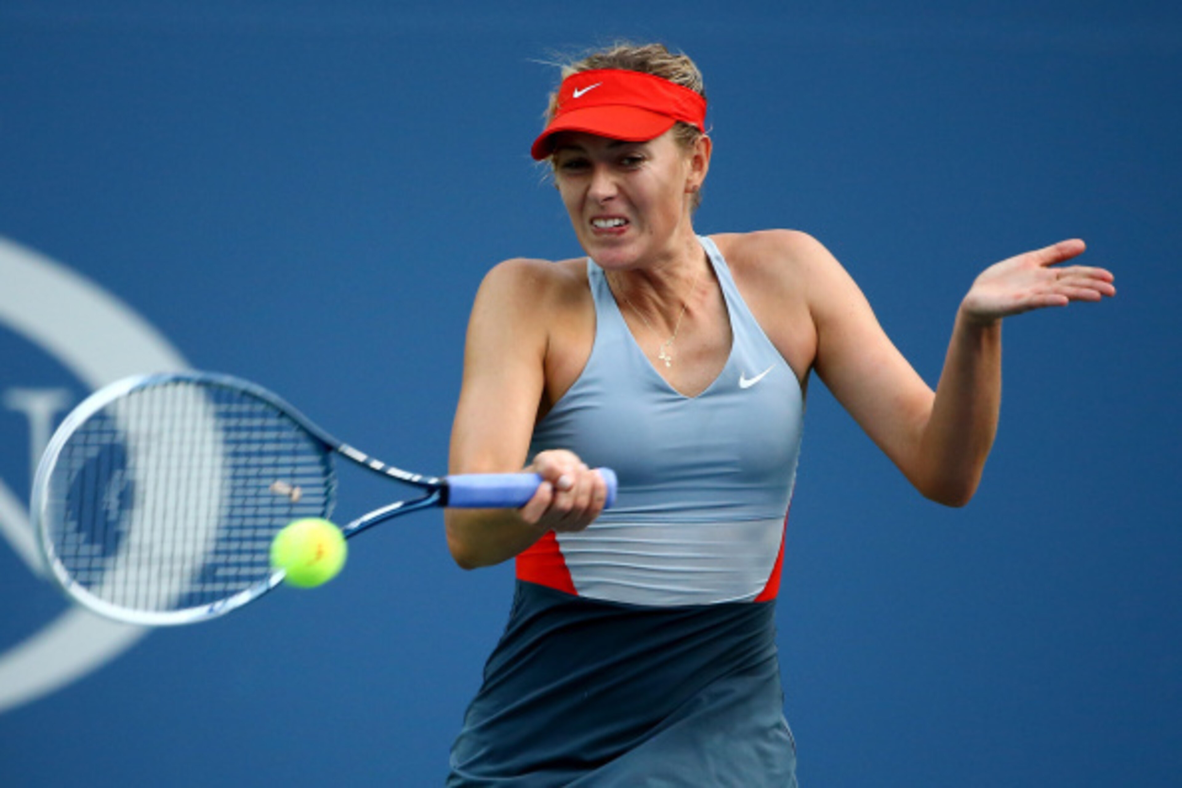 NEW YORK, NY - AUGUST 27:  Maria Sharapova of Russia returns a shot against Alexandra Dulgheru of Romania during their women's singles second round match on Day Three of the 2014 US Open at the USTA Billie Jean King National Tennis Center on August 27, 20