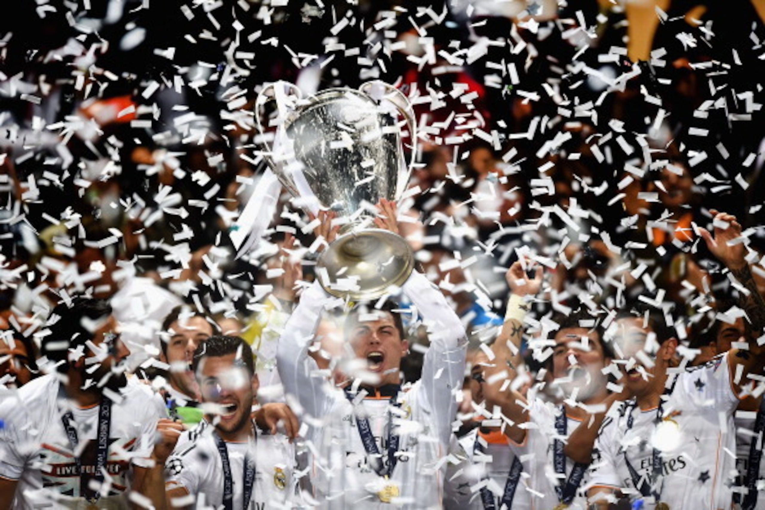 LISBON, PORTUGAL - MAY 24: Cristiano Ronaldo of Real Madrid lifts the Champions league trophy during the during the UEFA Champions League Final between Real Madrid and Atletico de Madrid at Estadio da Luz on May 24, 2014 in Lisbon, Portugal.  (Photo by La