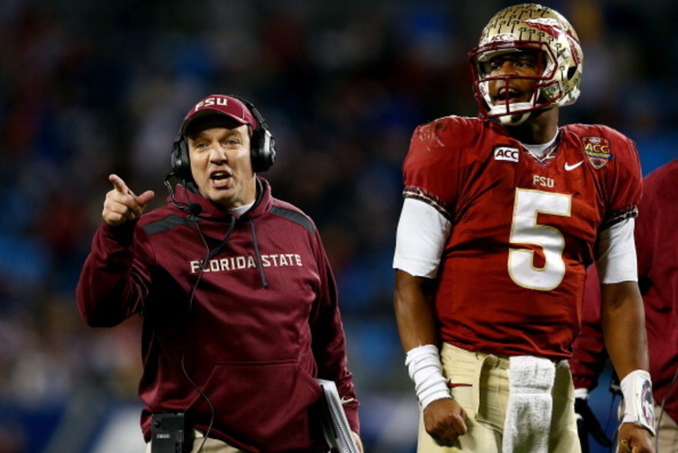 CHARLOTTE, NC - DECEMBER 07:  Head coach Jimbo Fisher and quarterback Jameis Winston #5 of the Florida State Seminoles looks on against the Duke Blue Devils during the ACC Championship game at Bank of America Stadium on December 7, 2013 in Charlotte, Nort