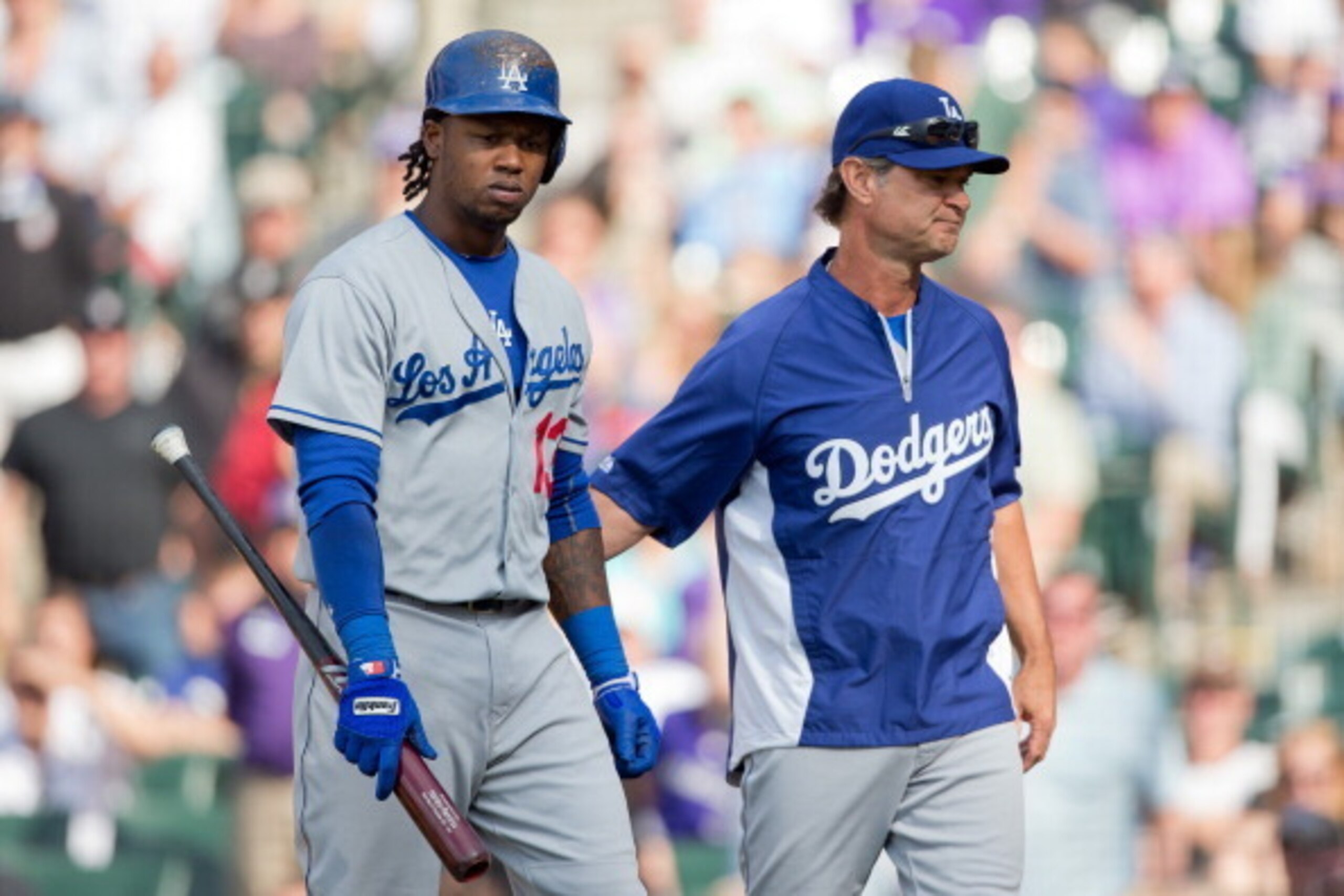 DENVER, CO - JUNE 7:  Manager Don Mattingly consoles Hanley Ramirez #13 of the Los Angeles Dodgers after Ramirez struck out during the ninth inning against the Colorado Rockies at Coors Field on June 7, 2014 in Denver, Colorado. The Rockies defeated the D