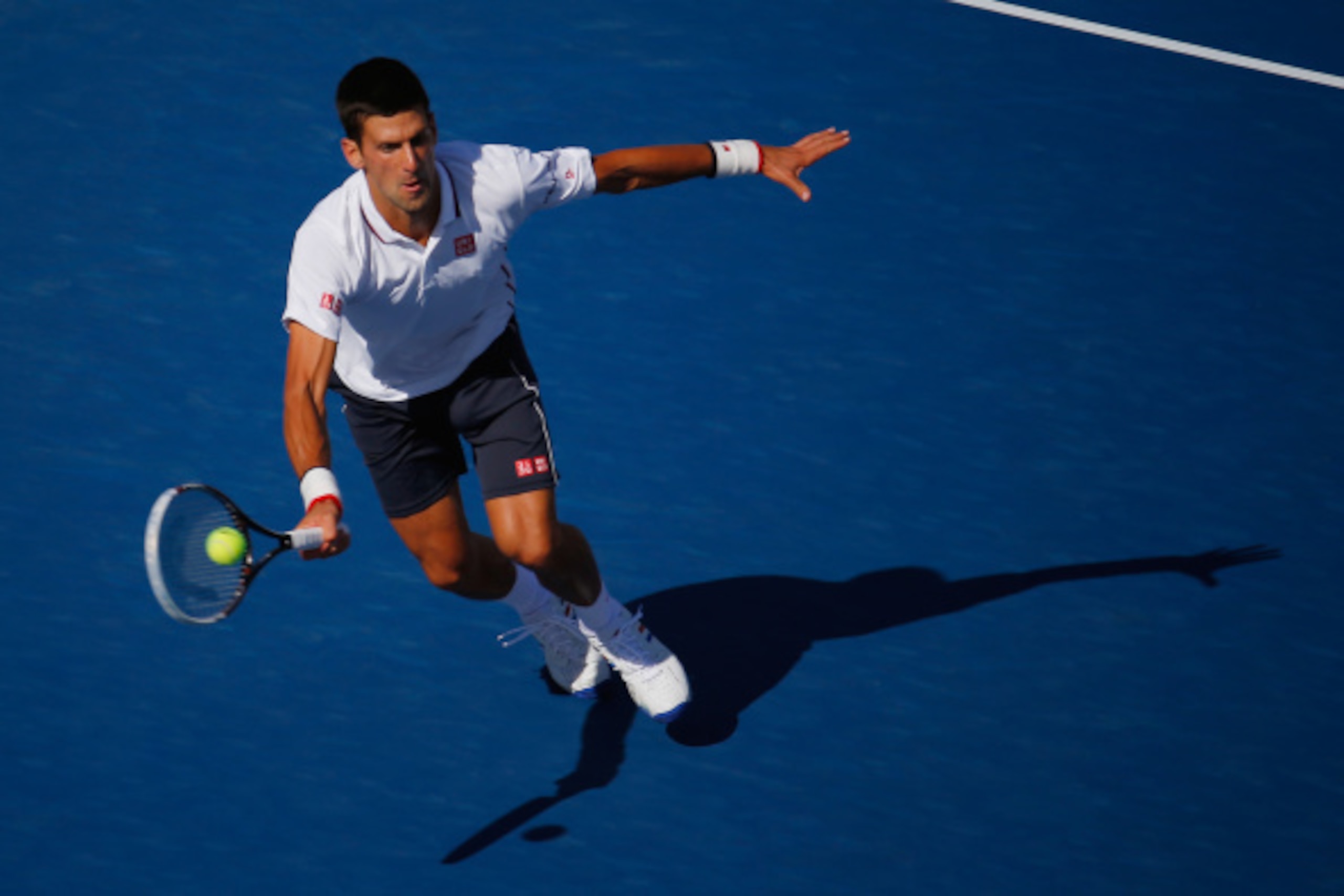 NEW YORK, NY - AUGUST 28:  Novak Djokovic of Serbia returns a shot against Paul-Henri Mathieu of France during their men's second round match on Day Four of the 2014 US Open at the USTA Billie Jean King National Tennis Center on August 28, 2014 in the Flu