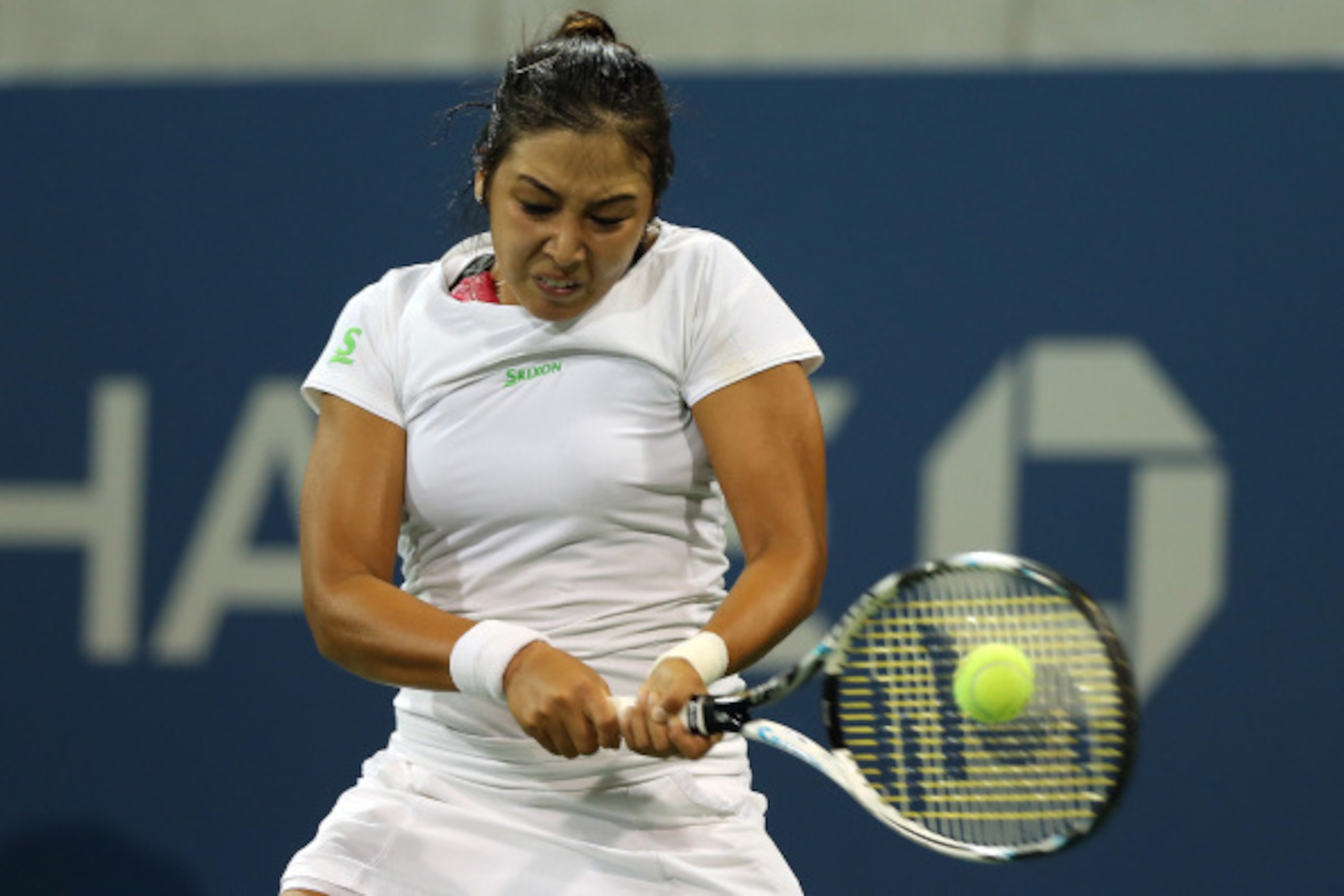 NEW YORK, NY - AUGUST 28:   Zarina Diyas of Kazakhstan returns a shot against Catherine 'CiCi' Bellis of the United Statesduring their women's singles second round match on Day Four of the 2014 US Open at the USTA Billie Jean King National Tennis Center o