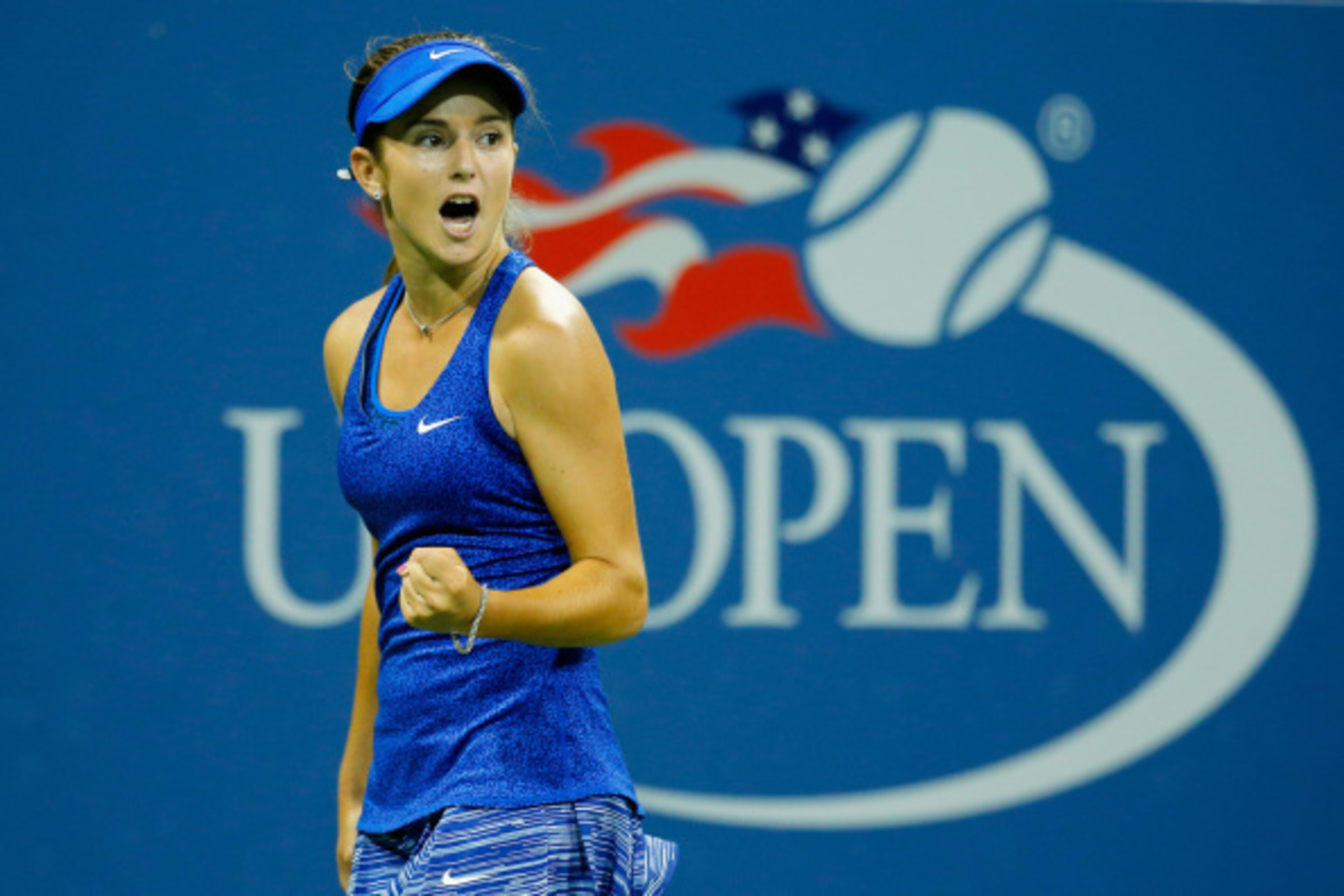 NEW YORK, NY - AUGUST 28:  Catherine 'CiCi' Bellis of the United States reacts against Zarina Diyas of Kazakhstan during their women's singles second round match on Day Four of the 2014 US Open at the USTA Billie Jean King National Tennis Center on August