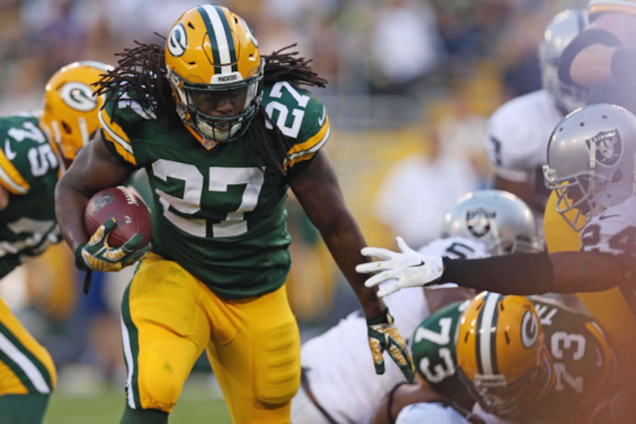 GREEN BAY, WI - AUGUST 22:  Eddie Lacy #27 of the Green Bay Packers runs during the first quarter of a preseason game against the Oakland Raiders at Lambeau Field on August 22, 2014 in Green Bay, Wisconsin.  (Photo by Jonathan Daniel/Getty Images)