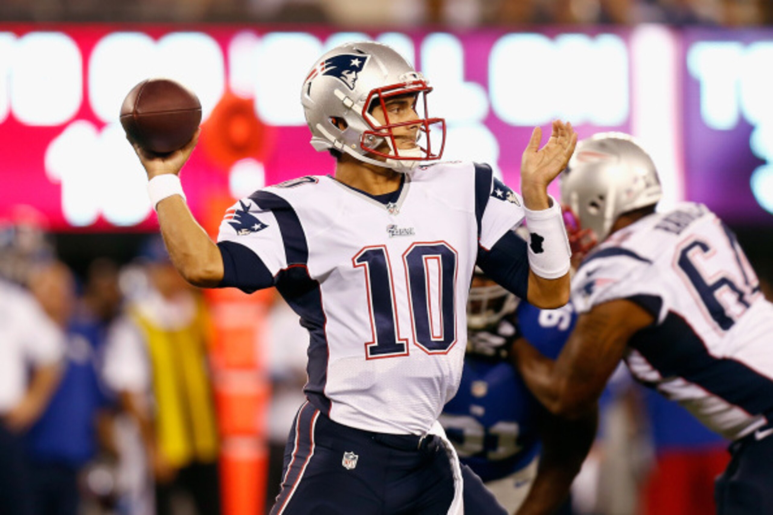 EAST RUTHERFORD, NJ - AUGUST 28:  Jimmy Garoppolo #10 of the New England Patriots draws back to pass against the New York Giants during the preseason game at MetLife Stadium on August 28, 2014 in East Rutherford, New Jersey.  (Photo by Jeff Zelevansky/Get