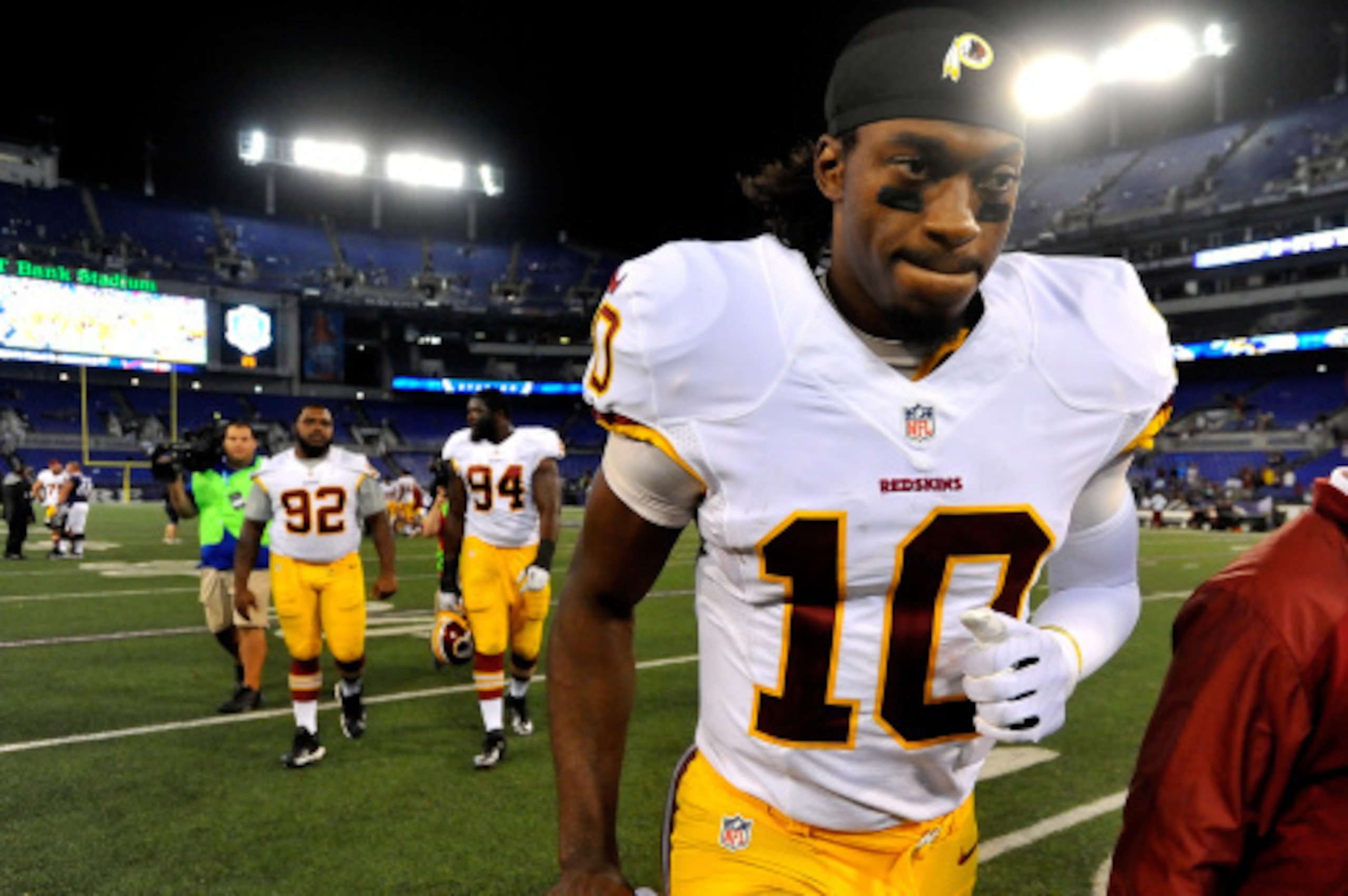 BALTIMORE, MD - AUGUST 23: Quarterback Robert Griffin III #10 of the Washington Redskins leaves the field after a preseason game against the Baltimore Ravens at M&T Bank Stadium on August 23, 2014 in Baltimore, Maryland.  (Photo by Larry French/Getty Imag