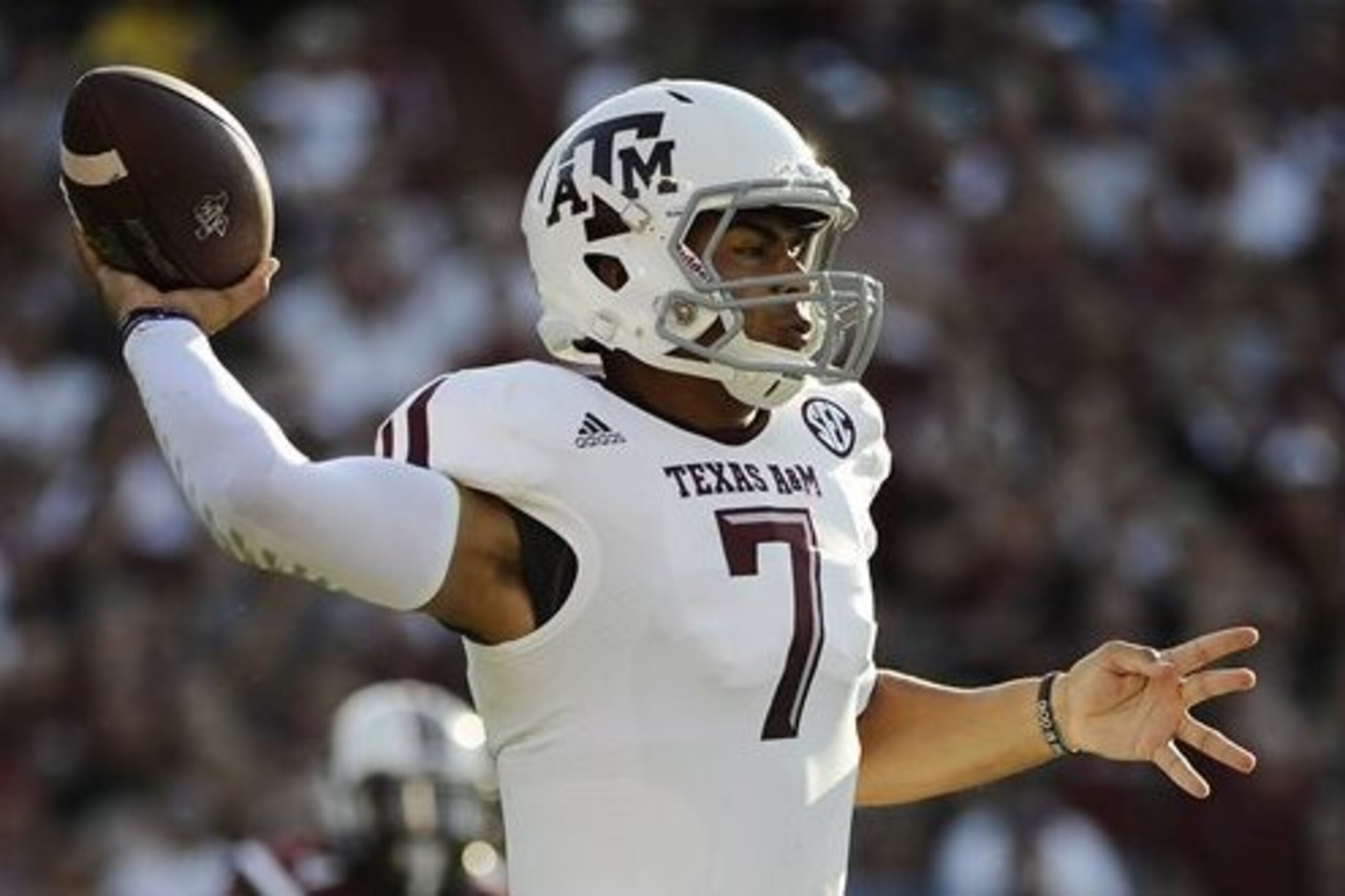 Kenny Hill set an Aggies passing record in throwing for 511 yards in Texas A&M's 52-28 win over South Carolina.