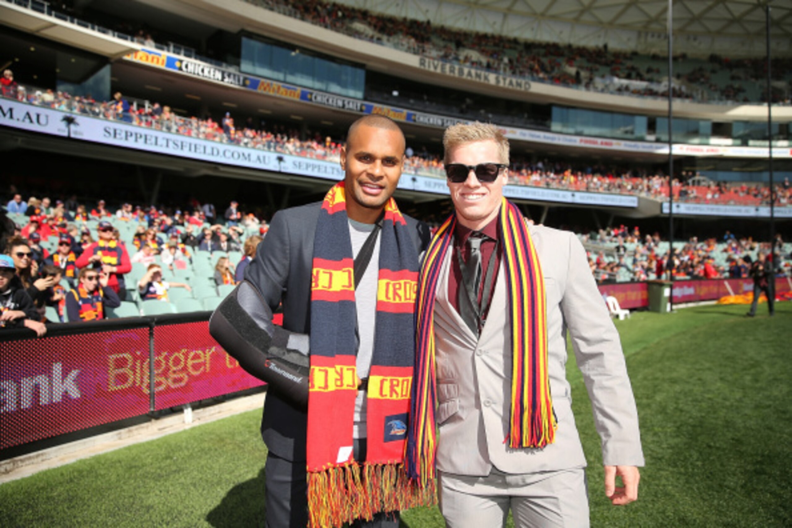 ADELAIDE, AUSTRALIA - AUGUST 02: Basketball player Patty Mills and BMX cyclist Sam Willoughby poses for a photo before completing a lap of honour around Adelaide Oval before the round 19 AFL match between the Adelaide Crows and the West Coast Eagles at A ADELAIDE, AUSTRALIA - AUGUST 02: Basketball player Patty Mills and BMX cyclist Sam Willoughby poses for a photo before completing a lap of honour around Adelaide Oval before the round 19 AFL match between the Adelaide Crows and the West Coast Eagles at A