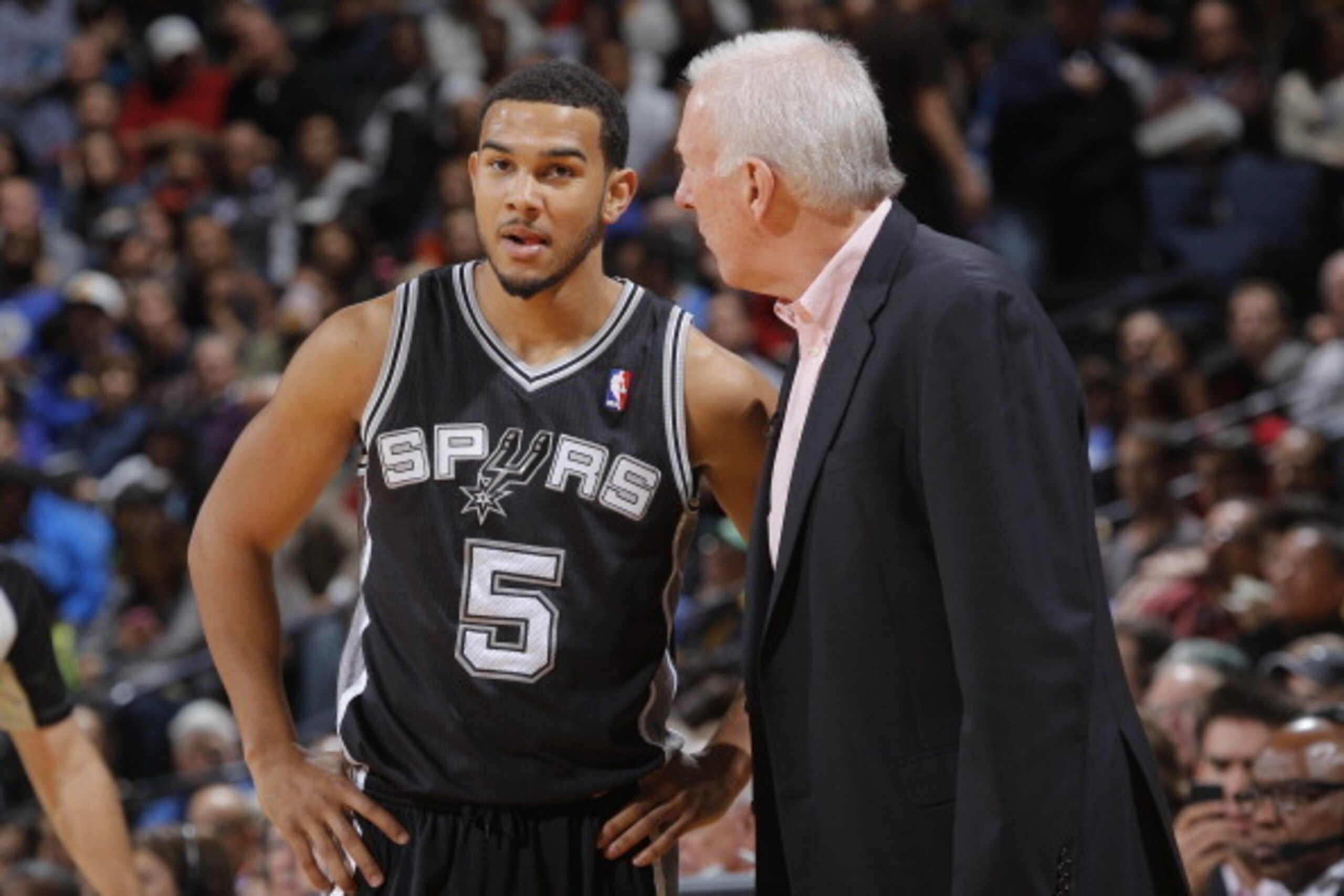 OAKLAND, CA - DECEMBER 19: Head Coach Gregg Popovich of the San Antonio Spurs coaches Cory Joseph #5 during the game against the Golden State Warriors on December 19, 2013 at Oracle Arena in Oakland, California. NOTE TO USER: User expressly acknowledges a OAKLAND, CA - DECEMBER 19: Head Coach Gregg Popovich of the San Antonio Spurs coaches Cory Joseph #5 during the game against the Golden State Warriors on December 19, 2013 at Oracle Arena in Oakland, California. NOTE TO USER: User expressly acknowledges a