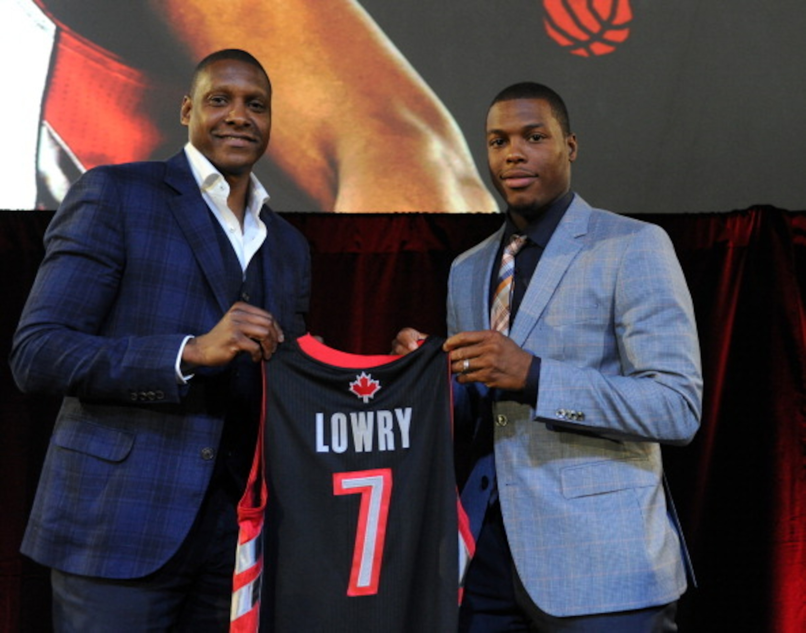 TORONTO, ON - JULY 10: Masai Ujiri and Kyle Lowry during the press conference after his singing of a contract extension with the Toronto Raptors at the Air Canada Centre on July 10, 2014 in Toronto, Ontario, Canada. NOTE TO USER: User expressly acknowled TORONTO, ON - JULY 10: Masai Ujiri and Kyle Lowry during the press conference after his singing of a contract extension with the Toronto Raptors at the Air Canada Centre on July 10, 2014 in Toronto, Ontario, Canada. NOTE TO USER: User expressly acknowled