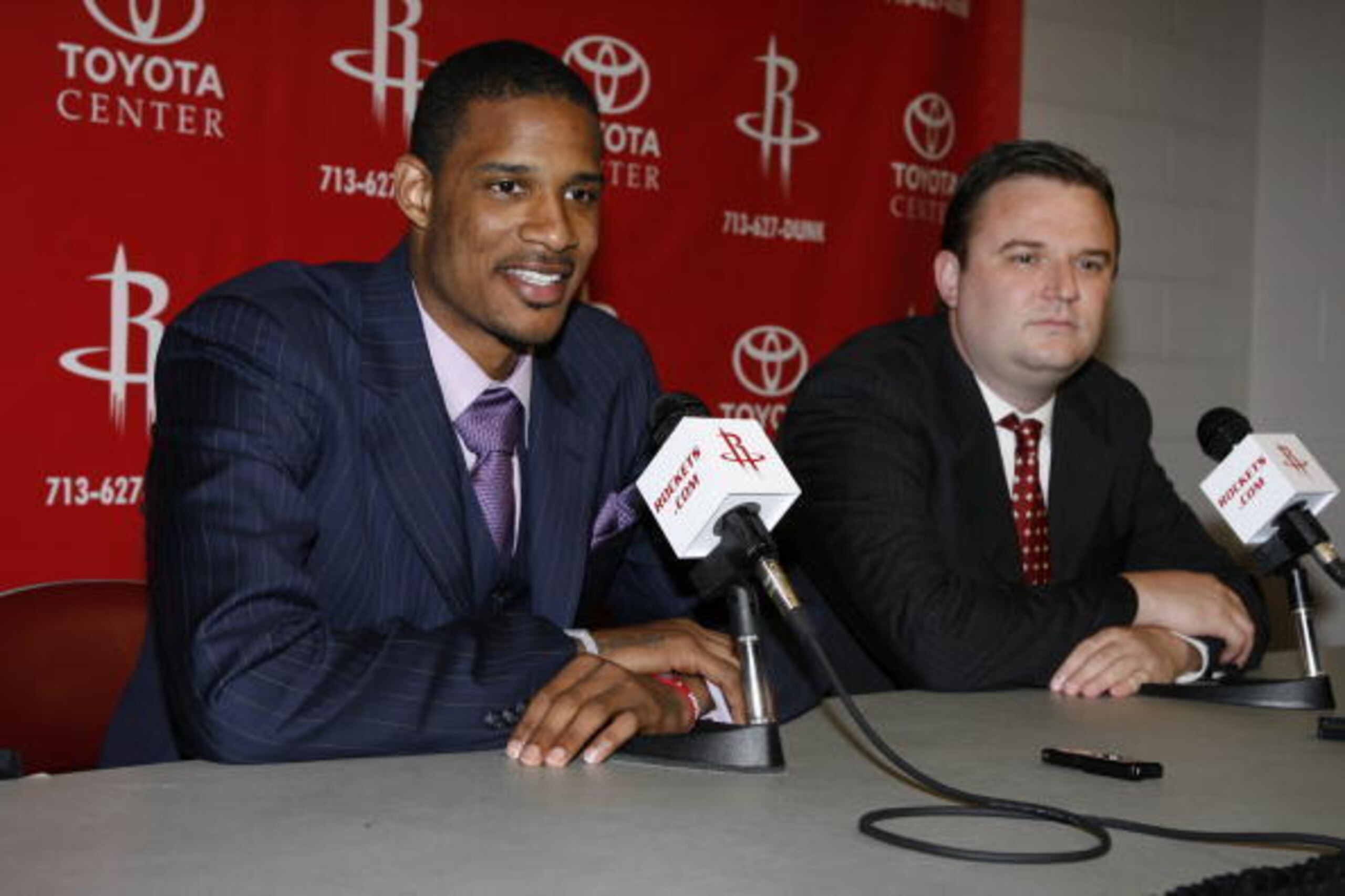 HOUSTON - JULY 8:  Trevor Ariza speaks at a press conference after signing with the Houston Rockets as Rockets GM Daryl Morey looks on at the Toyota Center on July 8, 2009 in Houston, Texas. NOTE TO USER: User expressly acknowledges and agrees that, by do