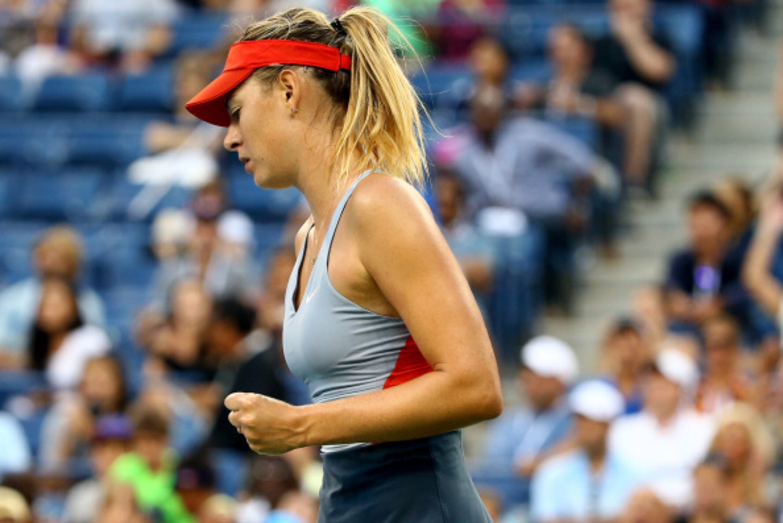 NEW YORK, NY - AUGUST 27: Maria Sharapova of Russia celebrates defeating Alexandra Dulgheru of Romania after their women's singles second round match on Day Three of the 2014 US Open at the USTA Billie Jean King National Tennis Center on August 27, 2014 NEW YORK, NY - AUGUST 27: Maria Sharapova of Russia celebrates defeating Alexandra Dulgheru of Romania after their women's singles second round match on Day Three of the 2014 US Open at the USTA Billie Jean King National Tennis Center on August 27, 2014