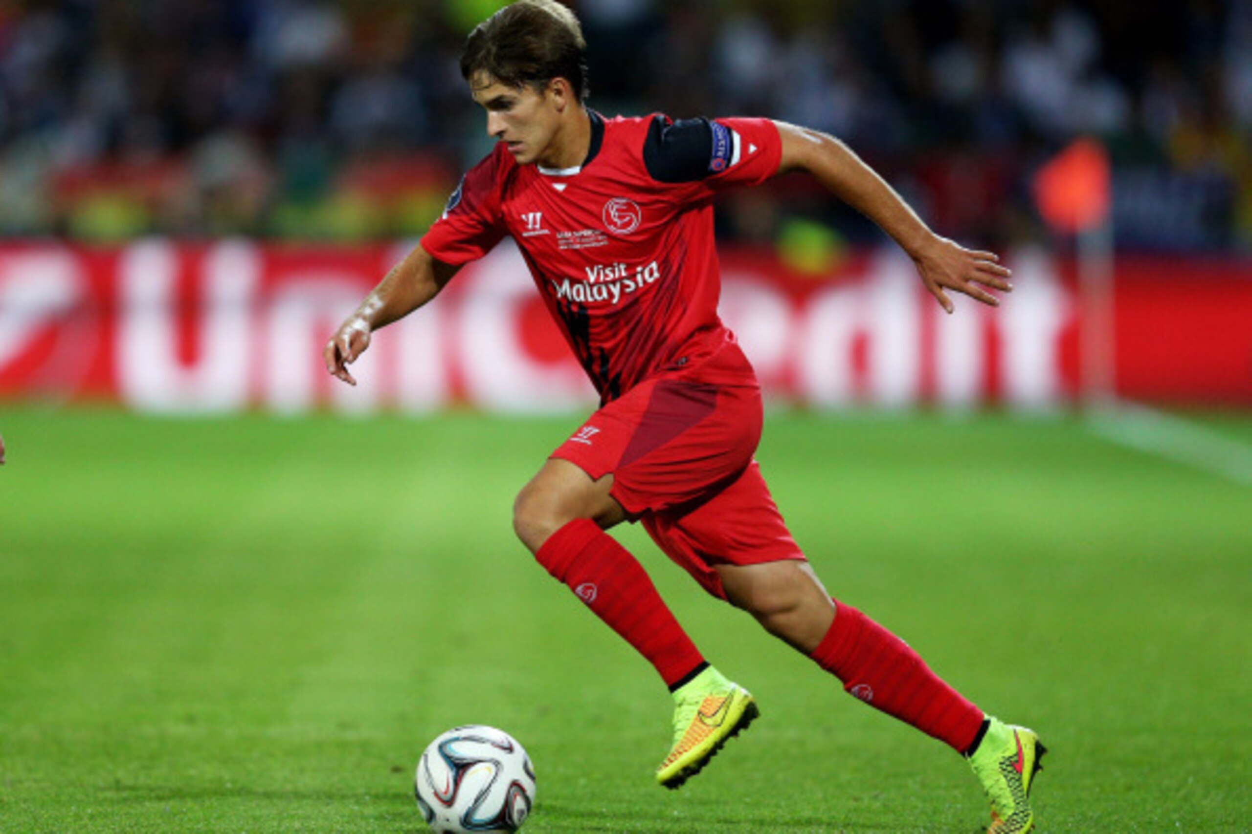 CARDIFF, WALES - AUGUST 12: Denis Suarez of Sevilla runs with the ball during the UEFA Super Cup between Real Madrid and Sevilla FC at Cardiff City Stadium on August 12, 2014 in Cardiff, Wales. (Photo by Clive Mason/Getty Images) CARDIFF, WALES - AUGUST 12: Denis Suarez of Sevilla runs with the ball during the UEFA Super Cup between Real Madrid and Sevilla FC at Cardiff City Stadium on August 12, 2014 in Cardiff, Wales. (Photo by Clive Mason/Getty Images)