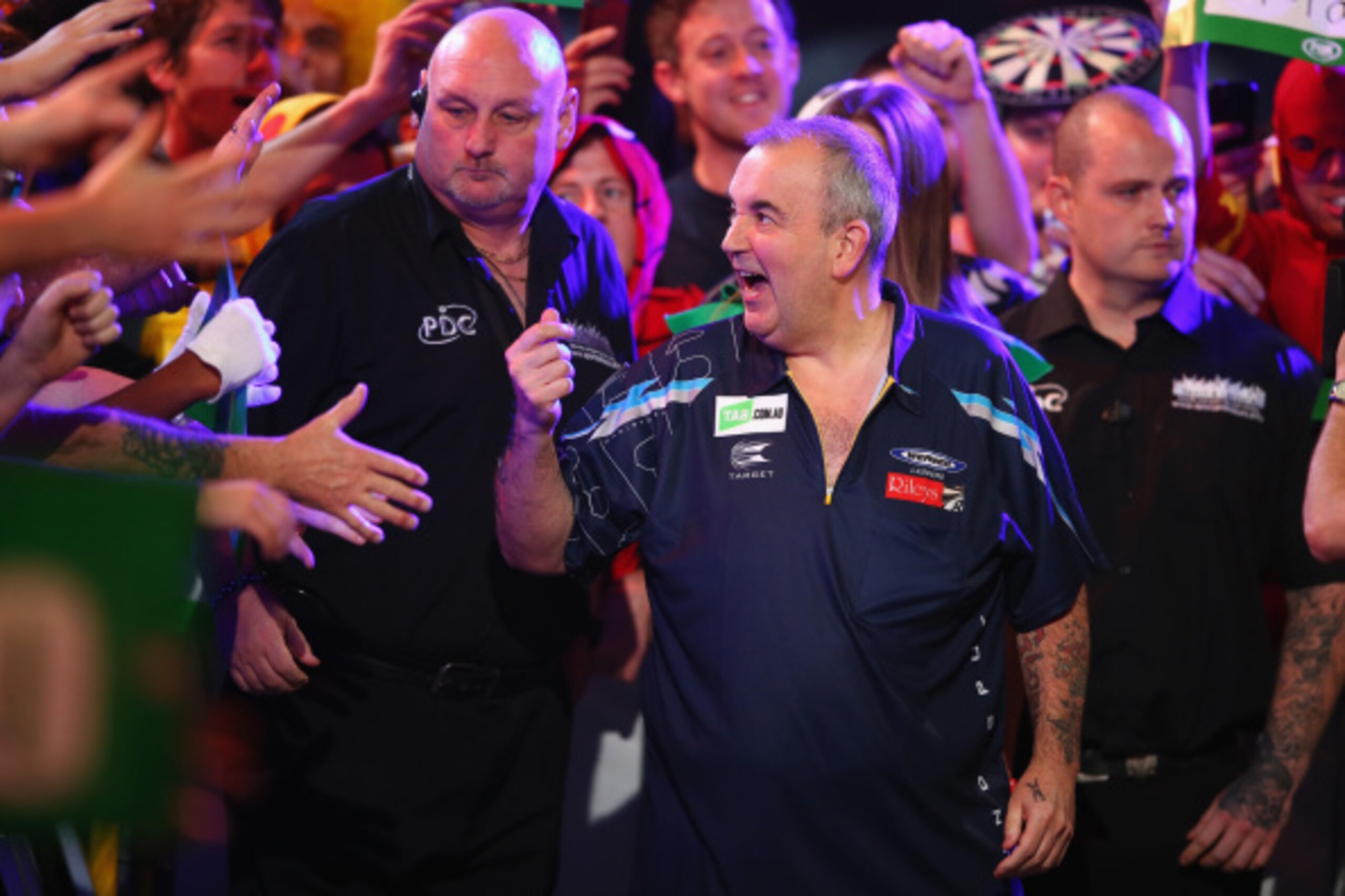 SYDNEY, AUSTRALIA - AUGUST 29:  Phil Taylor of England walks to the stage during his quarter-final match against Dave Chisnall of England during the Sydney Darts Masters at Hordern Pavilion on August 29, 2014 in Sydney, Australia.  (Photo by Mark Kolbe/Ge