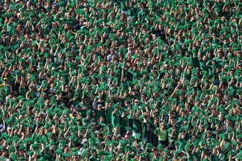 SOUTH BEND, IN - SEPTEMBER 28: Fans in the student section cheer as the Notre Dame Fighting Irish take on the Oklahoma Sooners at Notre Dame Stadium on September 28, 2013 in South Bend, Indiana. Oklahoma defeated Notre Dame 35-21. (Photo by Jonathan Danie